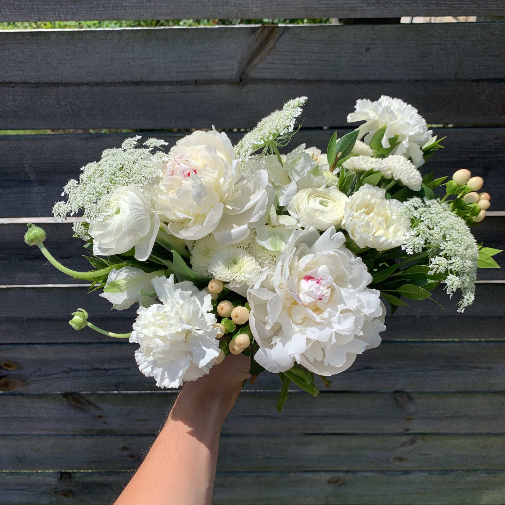 This arrangement is full of premium white and blush flowers. This arrangement