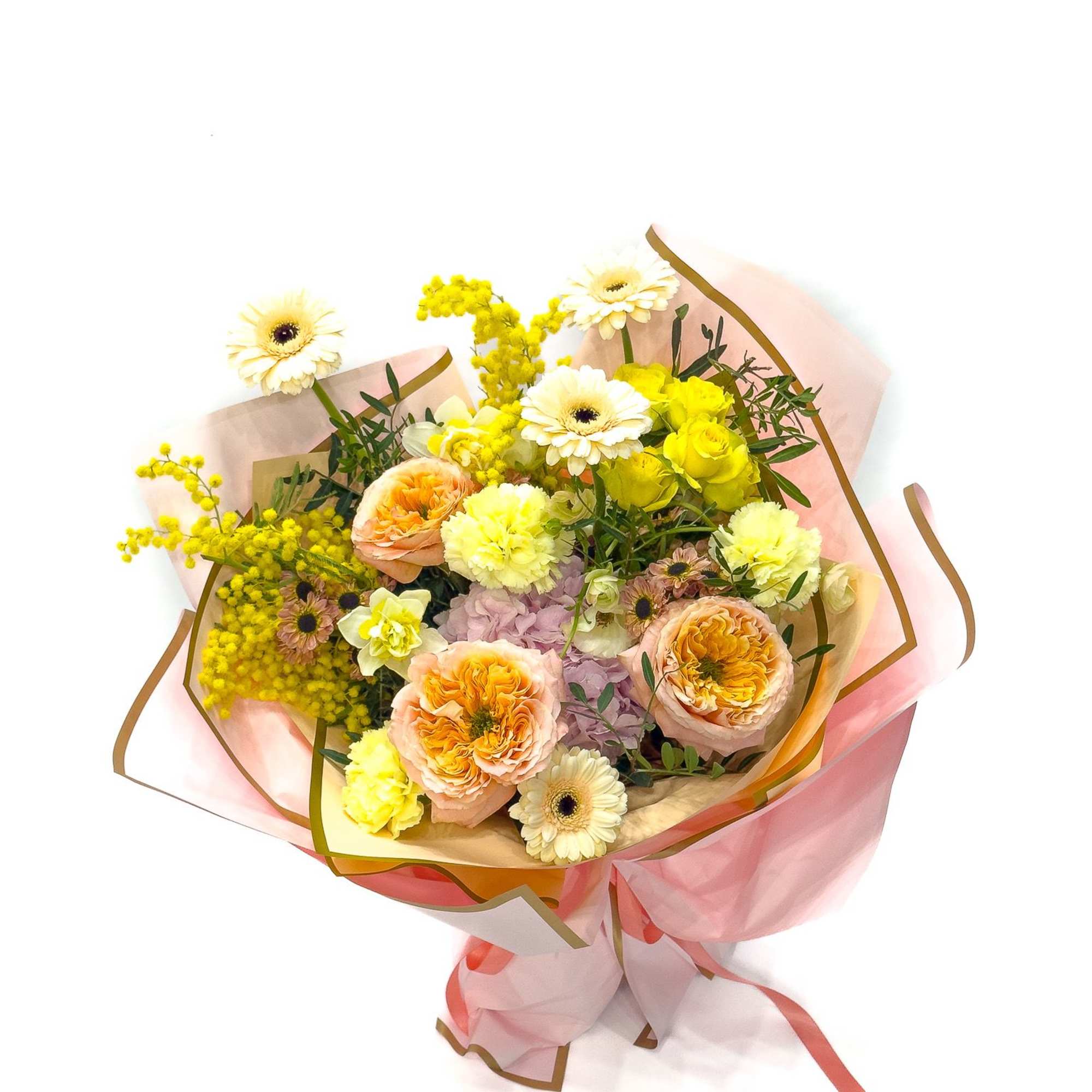 Bouquet of peach and yellow flowers wrapped in pink paper