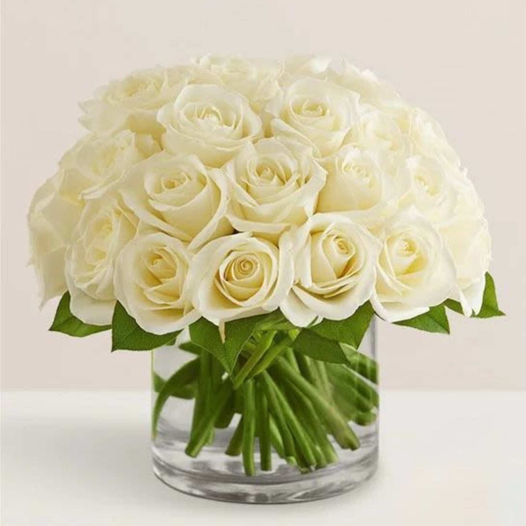 White rose bouquet in a clear glass vase