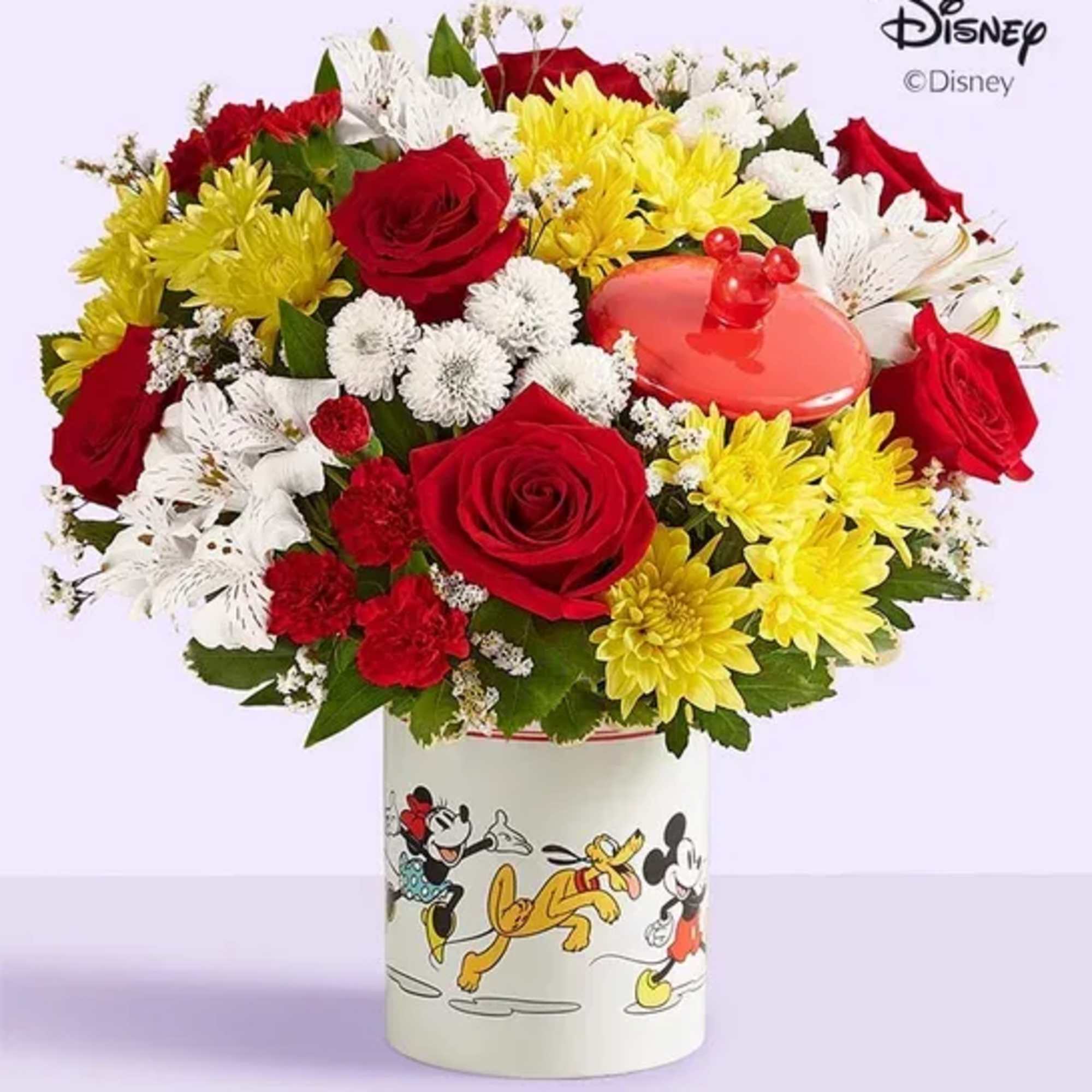Bouquet of red, yellow, and white flowers in a Mickey Mouse vase