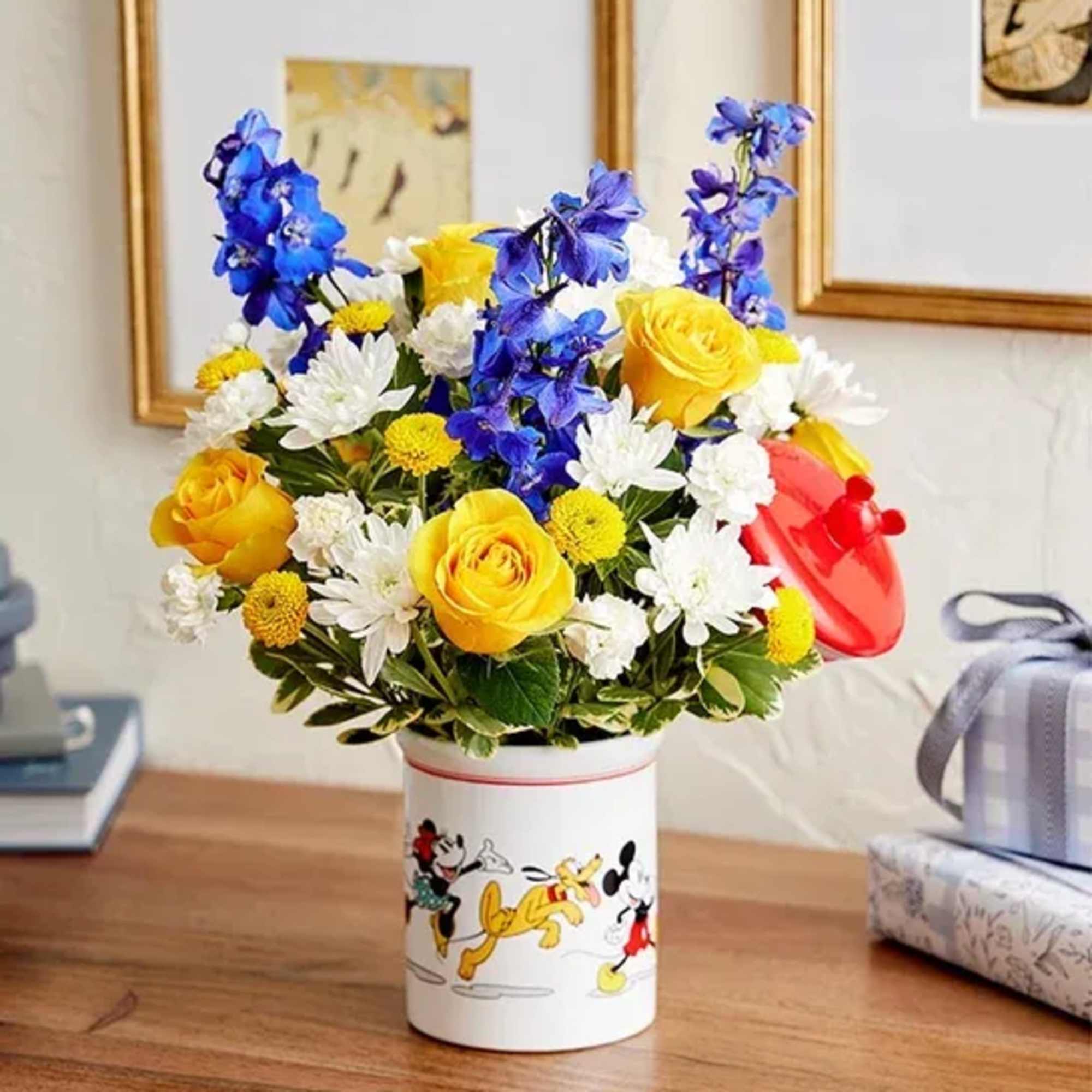 Bouquet of yellow roses, white daisies, and blue flowers in a Mickey Mouse tin, photo 2 of 5