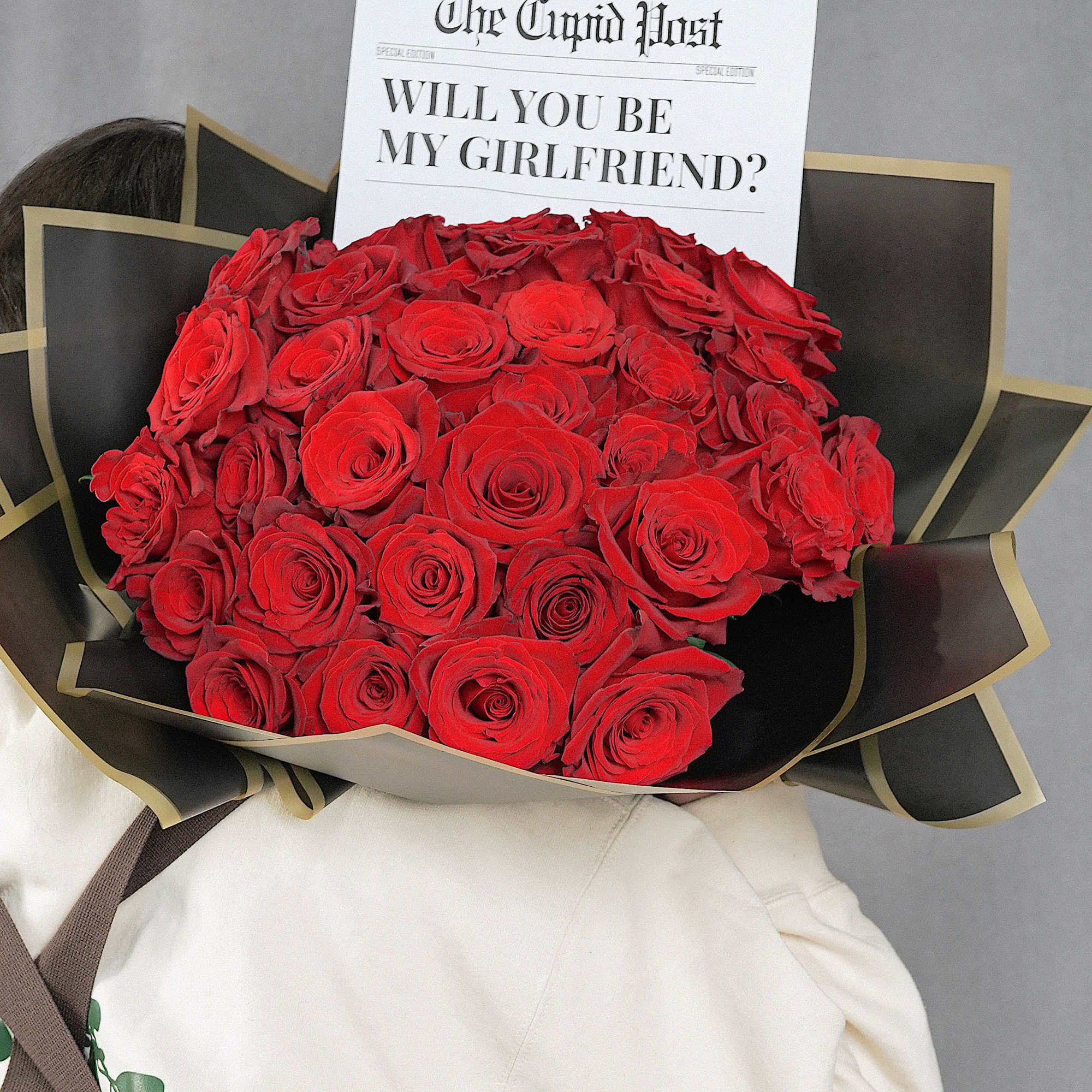 Bold and luxurious buch&oacute;n-style bouquet featuring 35 premium red roses, imported from