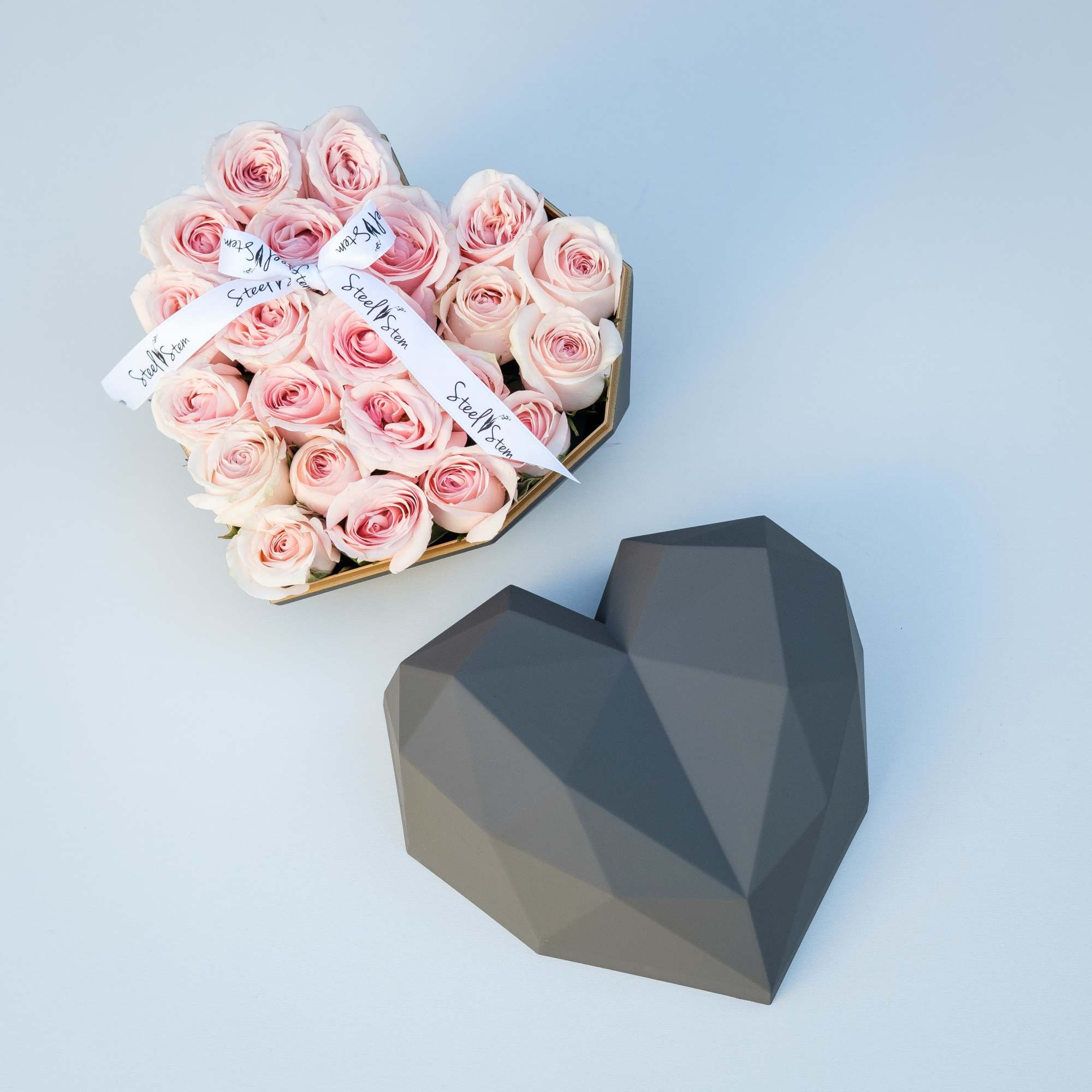 A luxurious heart shaped gift box is filled completely full of pretty, photo 2 of 3
