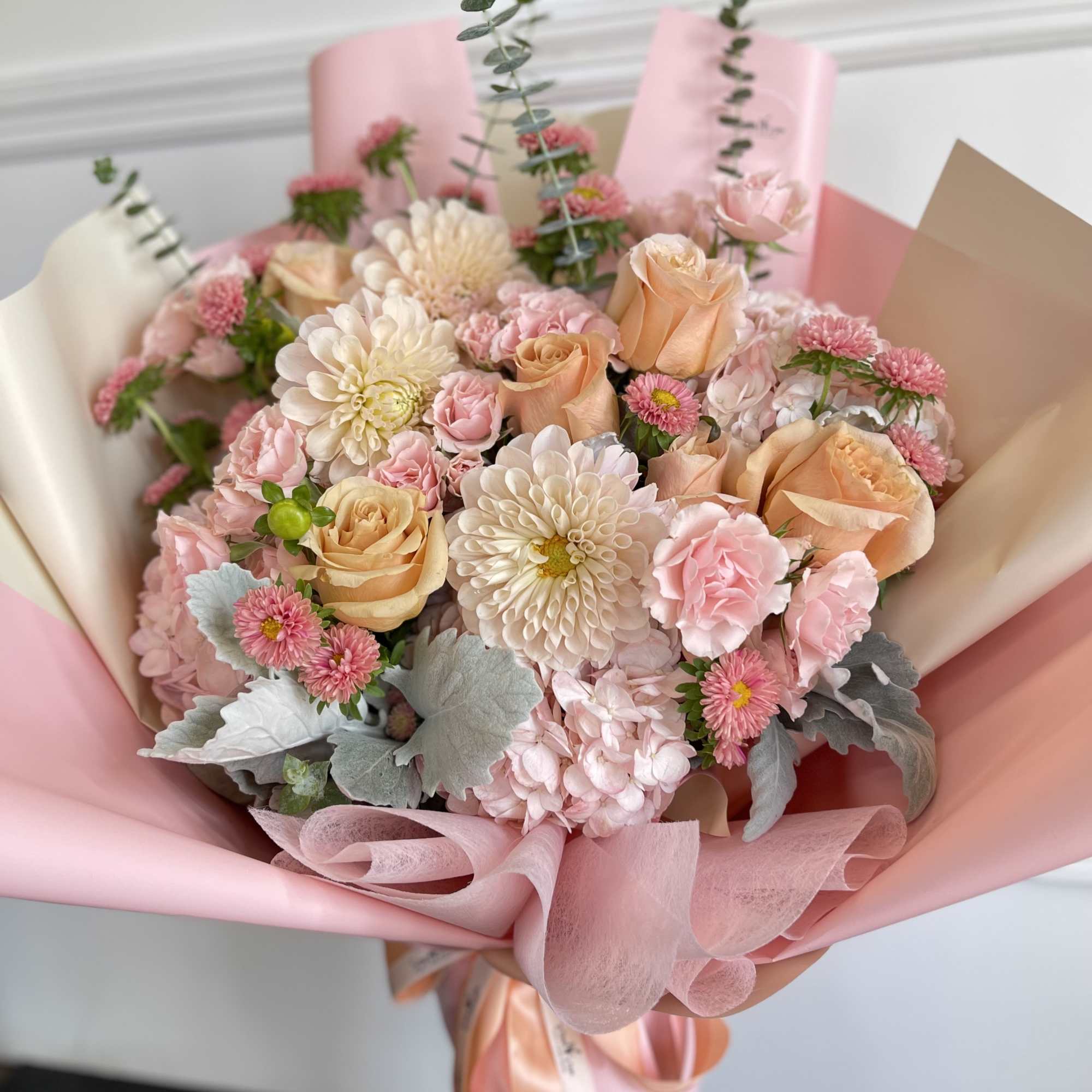 A lovely combination of soft colors florals with beautiful quality paper wrap.