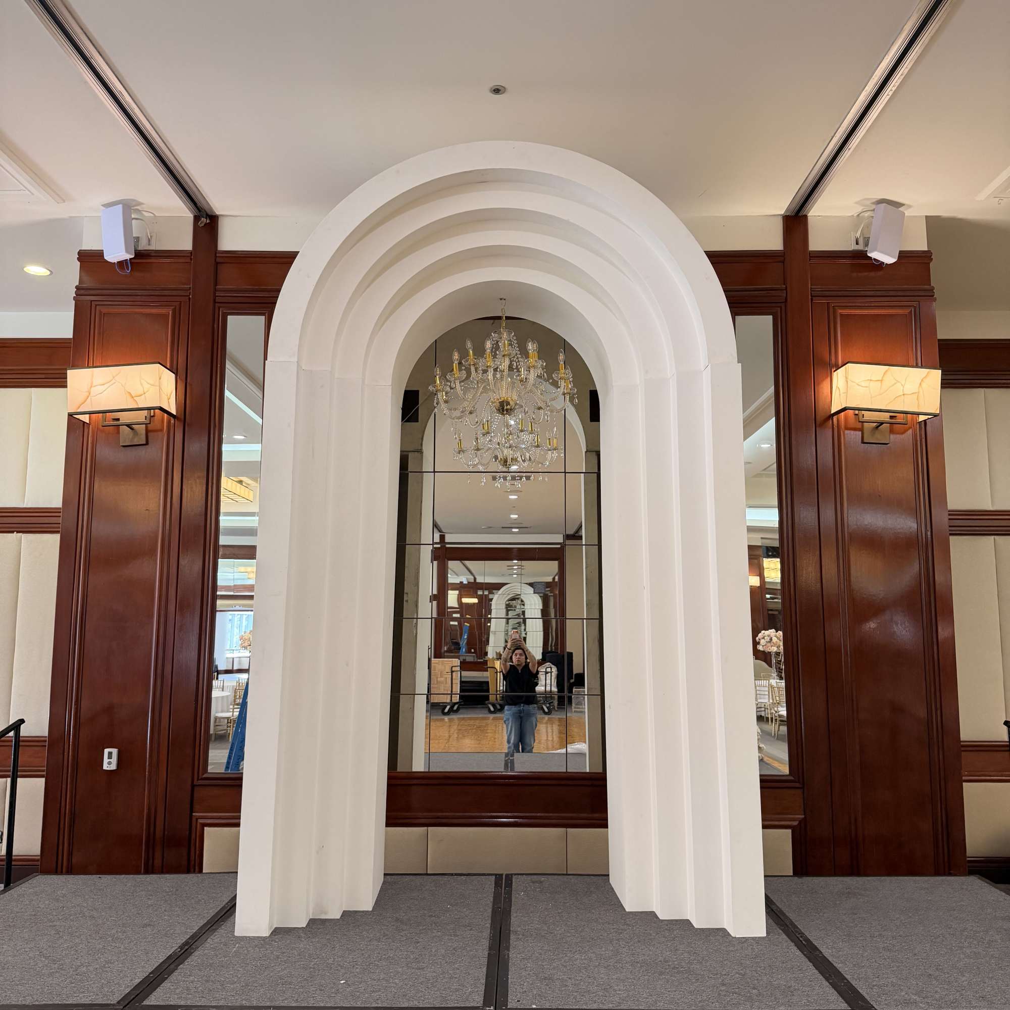 A sculptural layered backdrop designed for elevated celebrations. Featuring clean architectural lines