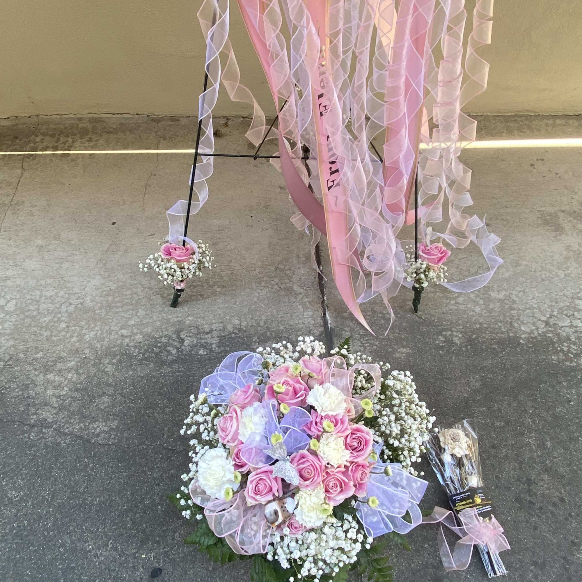 Pink rose bouquet with white filler flowers and ribbon streamers
