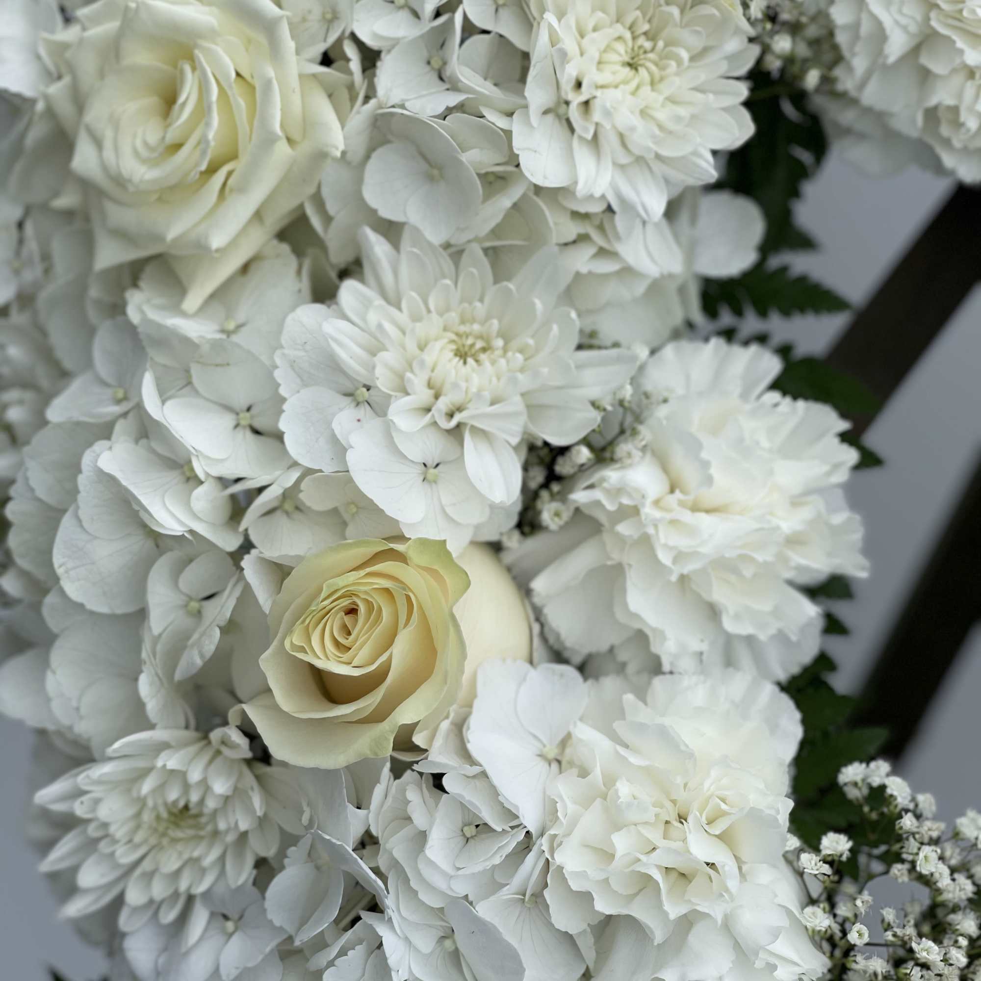 White bouquet with roses, hydrangeas, and chrysanthemums