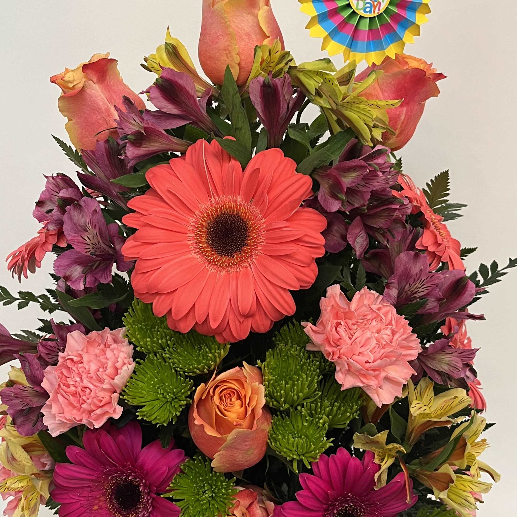 Colorful bouquet with gerbera daisies, roses, carnations, and alstroemeria