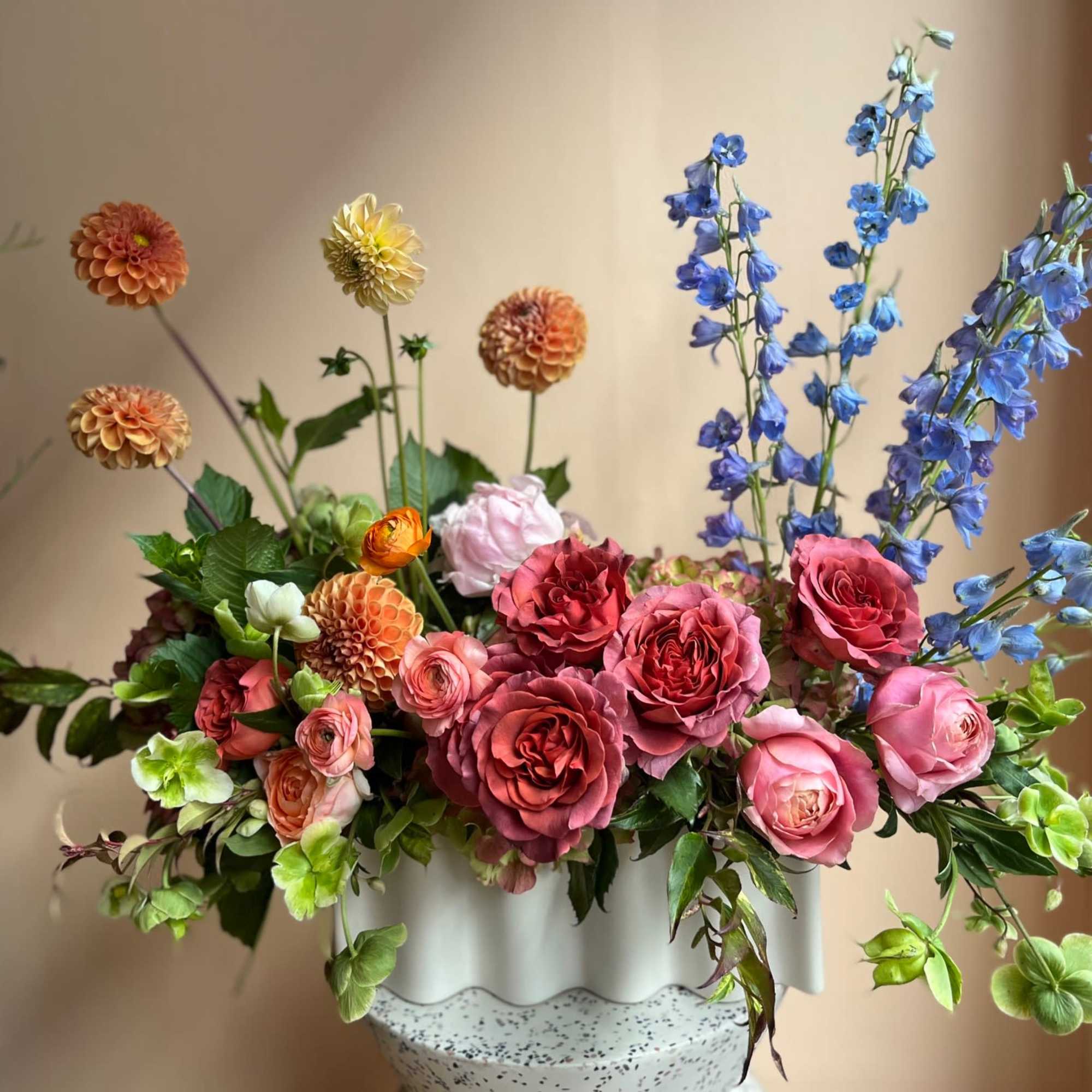 A long, low, and lush arrangement.  A true statement piece for, photo 2 of 3