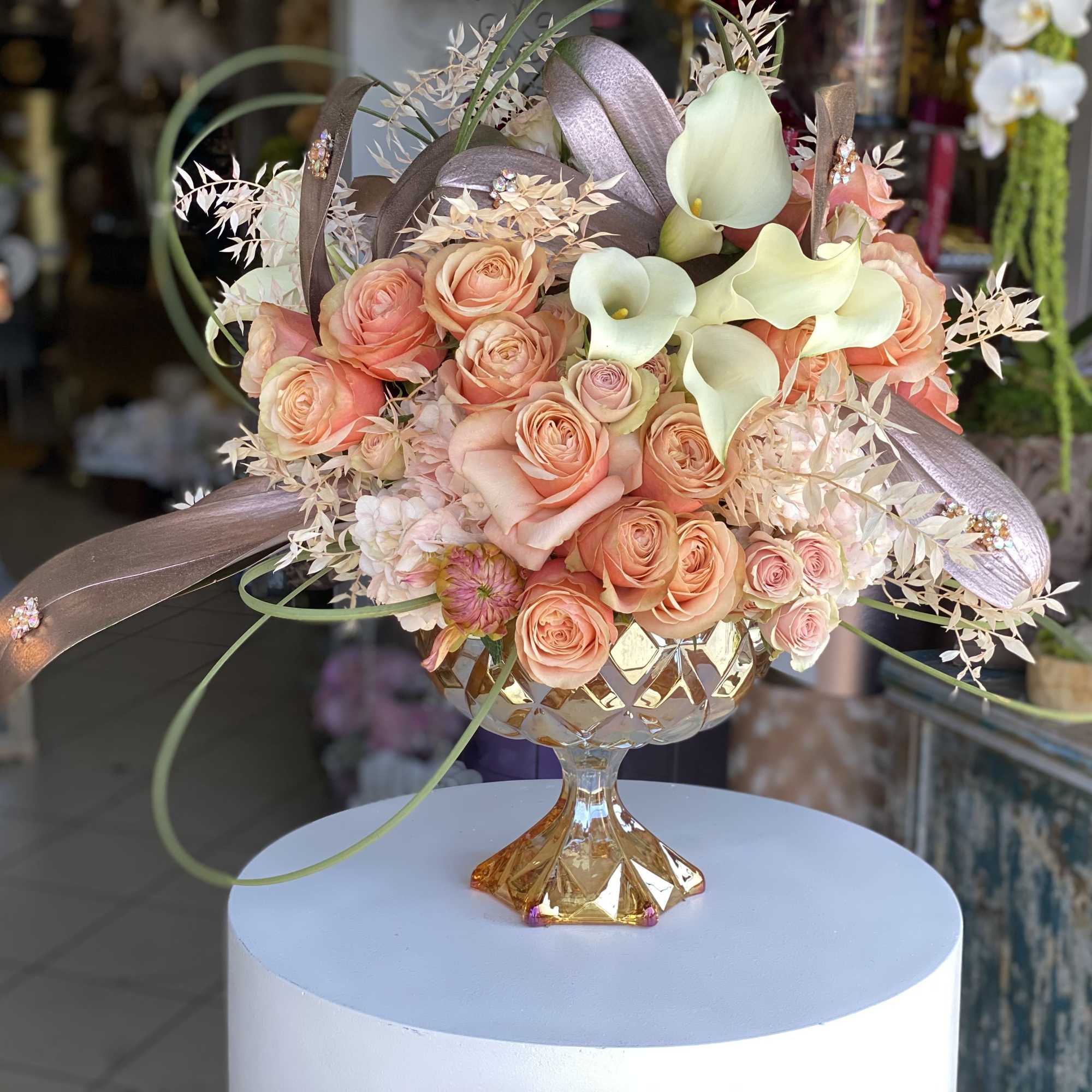 Peach, ivory, pastel tones in glass vase designed for elegance. 