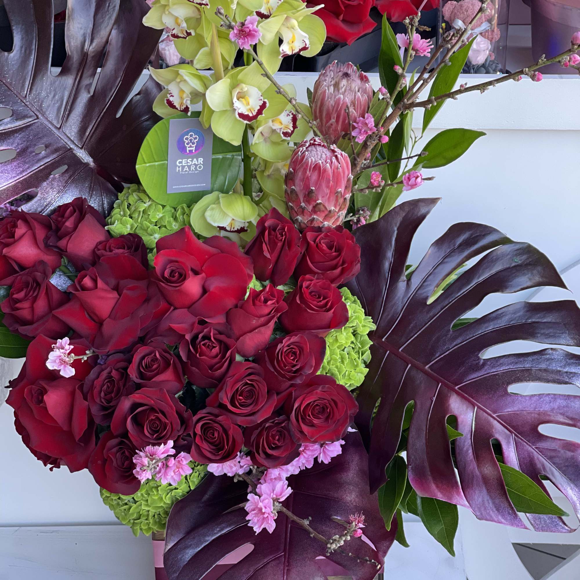 Flowers beautifully arranged inside of a square wood box