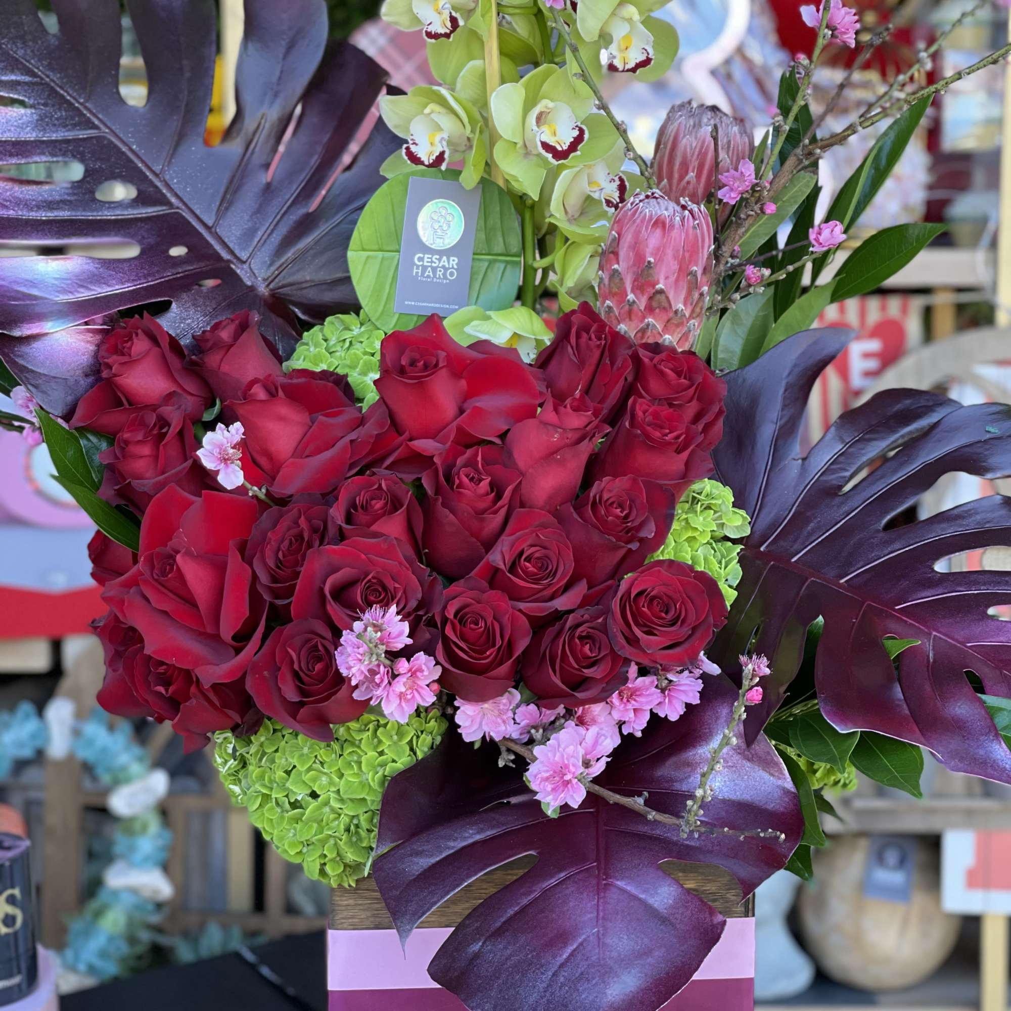 Flowers beautifully arranged inside of a square wood box, photo 2 of 2