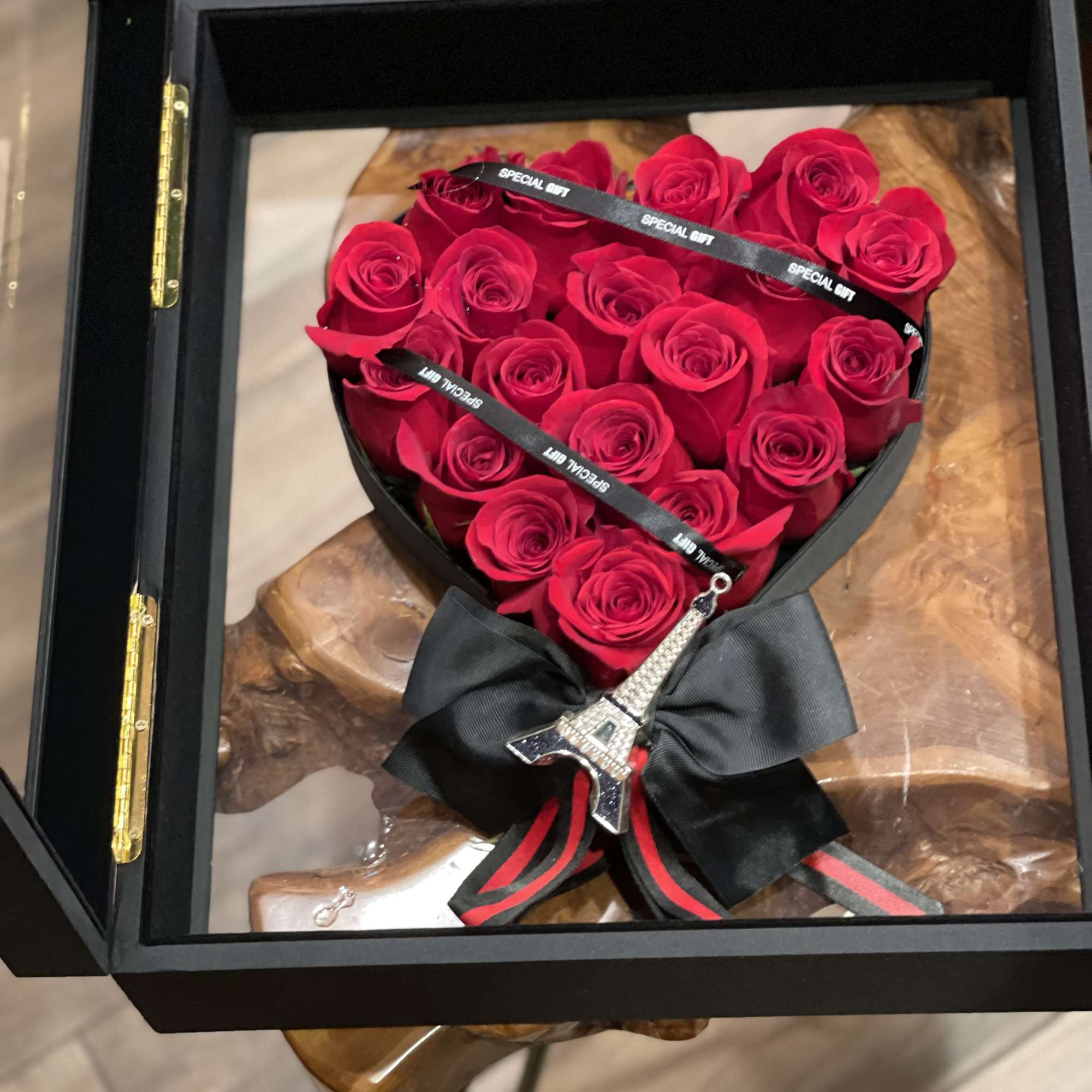 Briefcase with heart full of red roses inside, photo 2 of 3