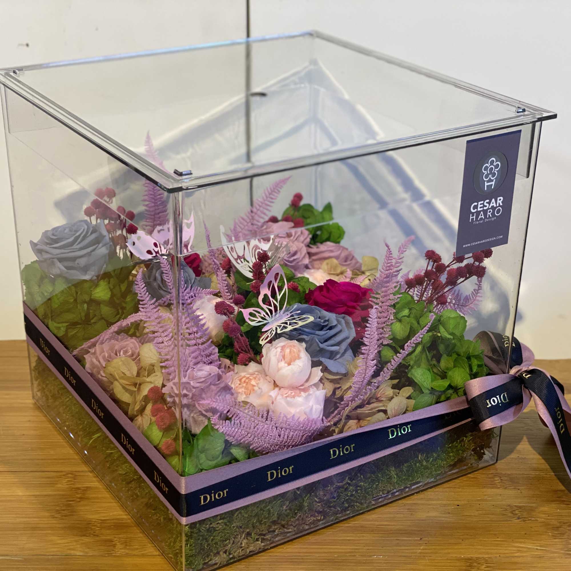 Beautiful clear~acrylic box
accented with vibrant preserved flowers