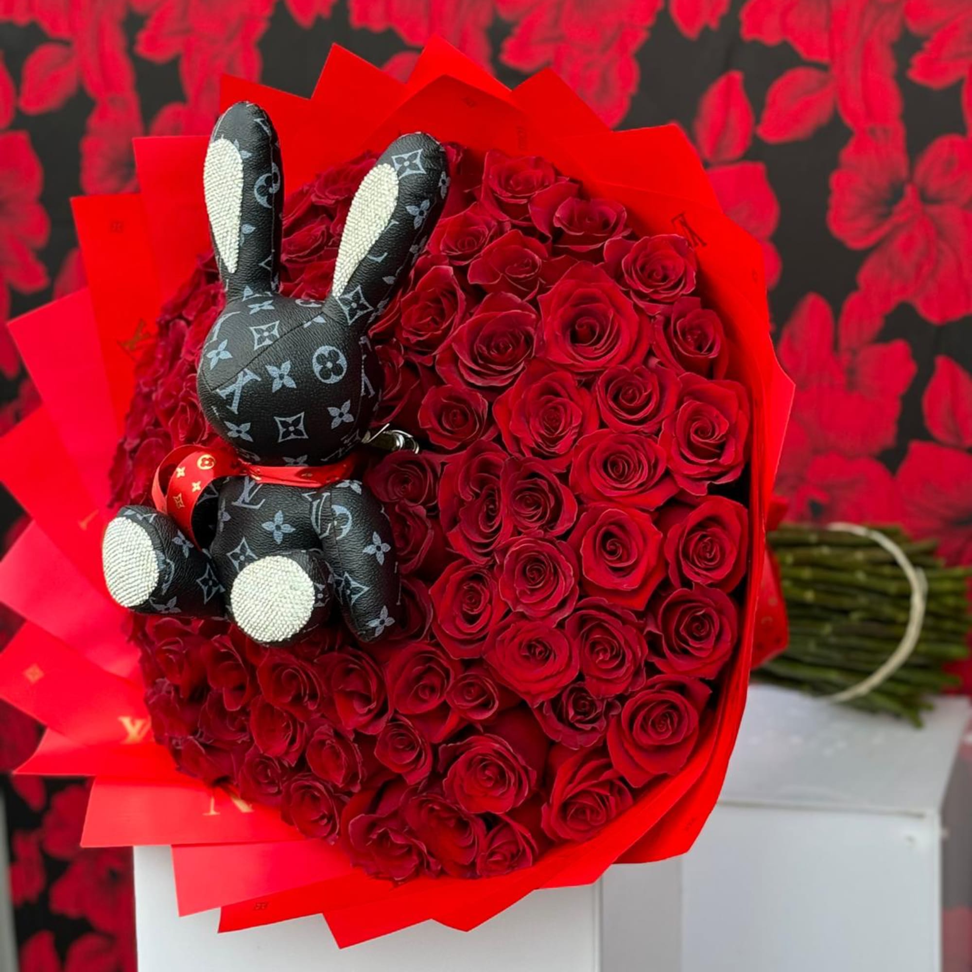 This show-stopping bouquet combines the timeless beauty of 100 vibrant red roses, photo 2 of 3