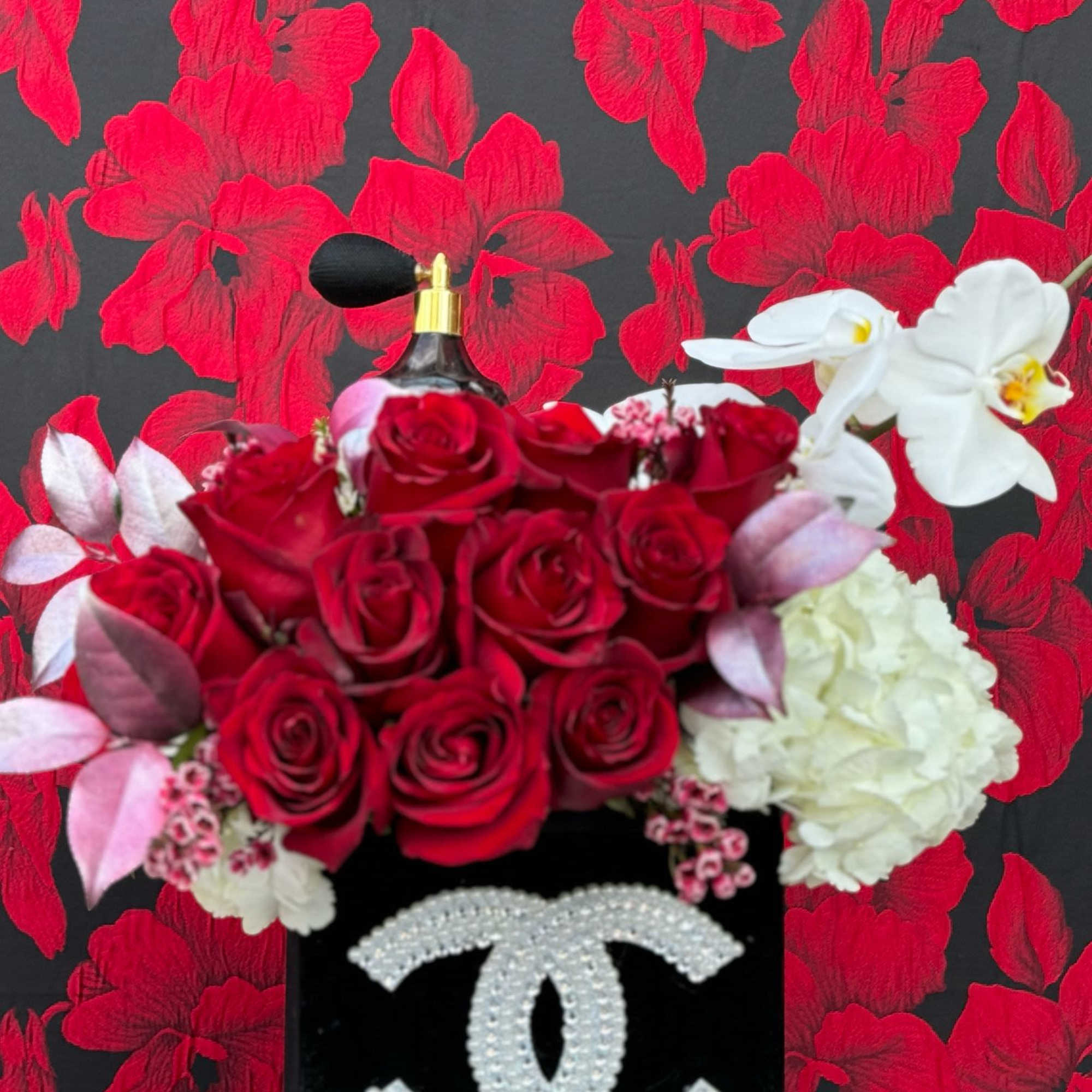 A luxurious arrangement of a dozen freshly cut, premium roses, along with