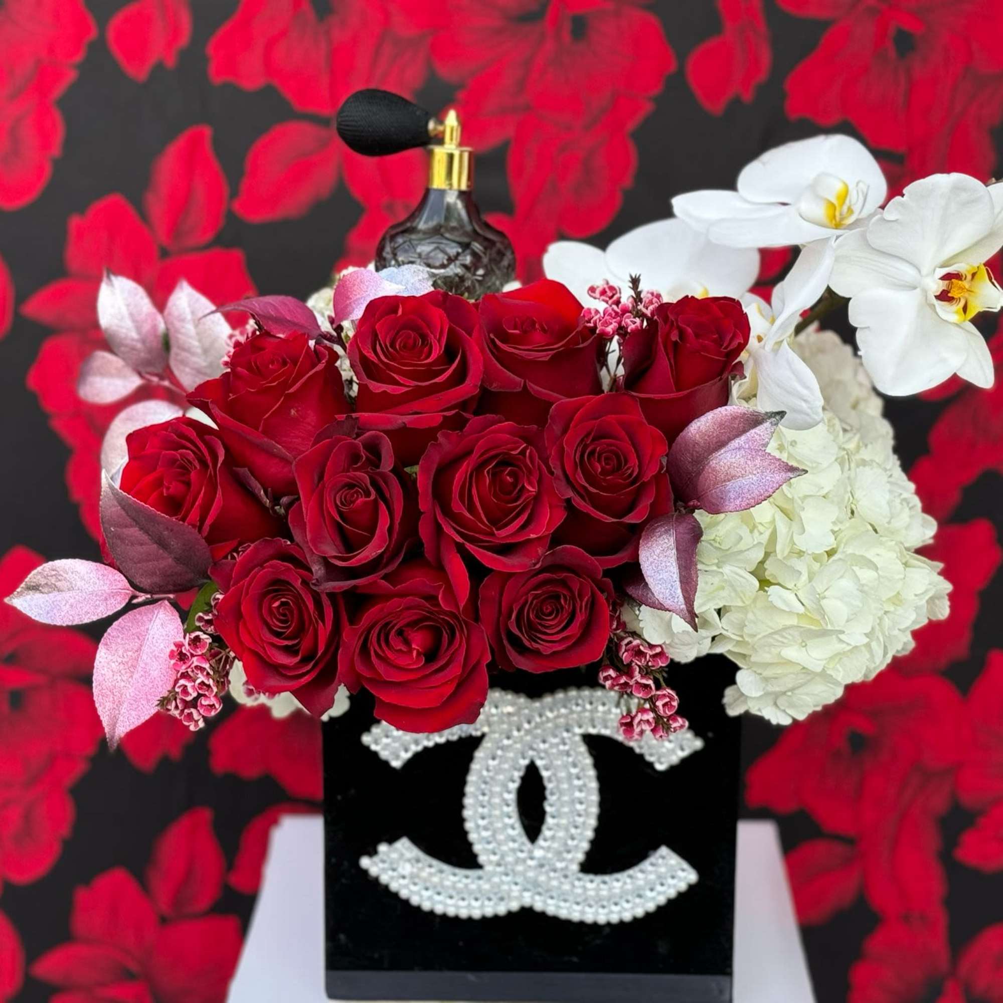 A luxurious arrangement of a dozen freshly cut, premium roses, along with, photo 2 of 3
