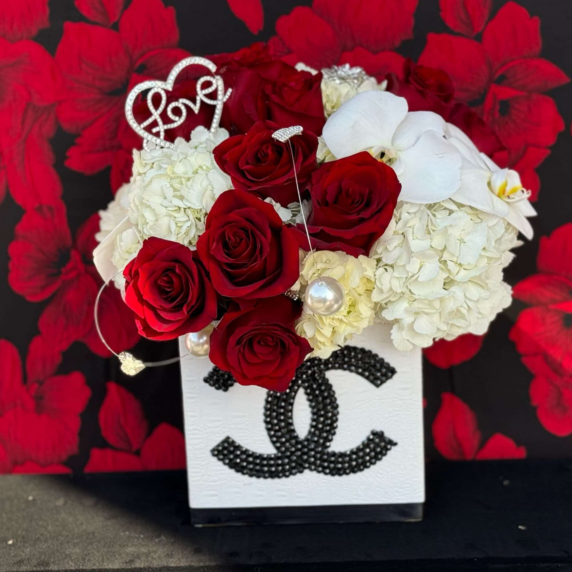 Experience the epitome of sophistication with this exquisite floral arrangement presented in, photo 2 of 3