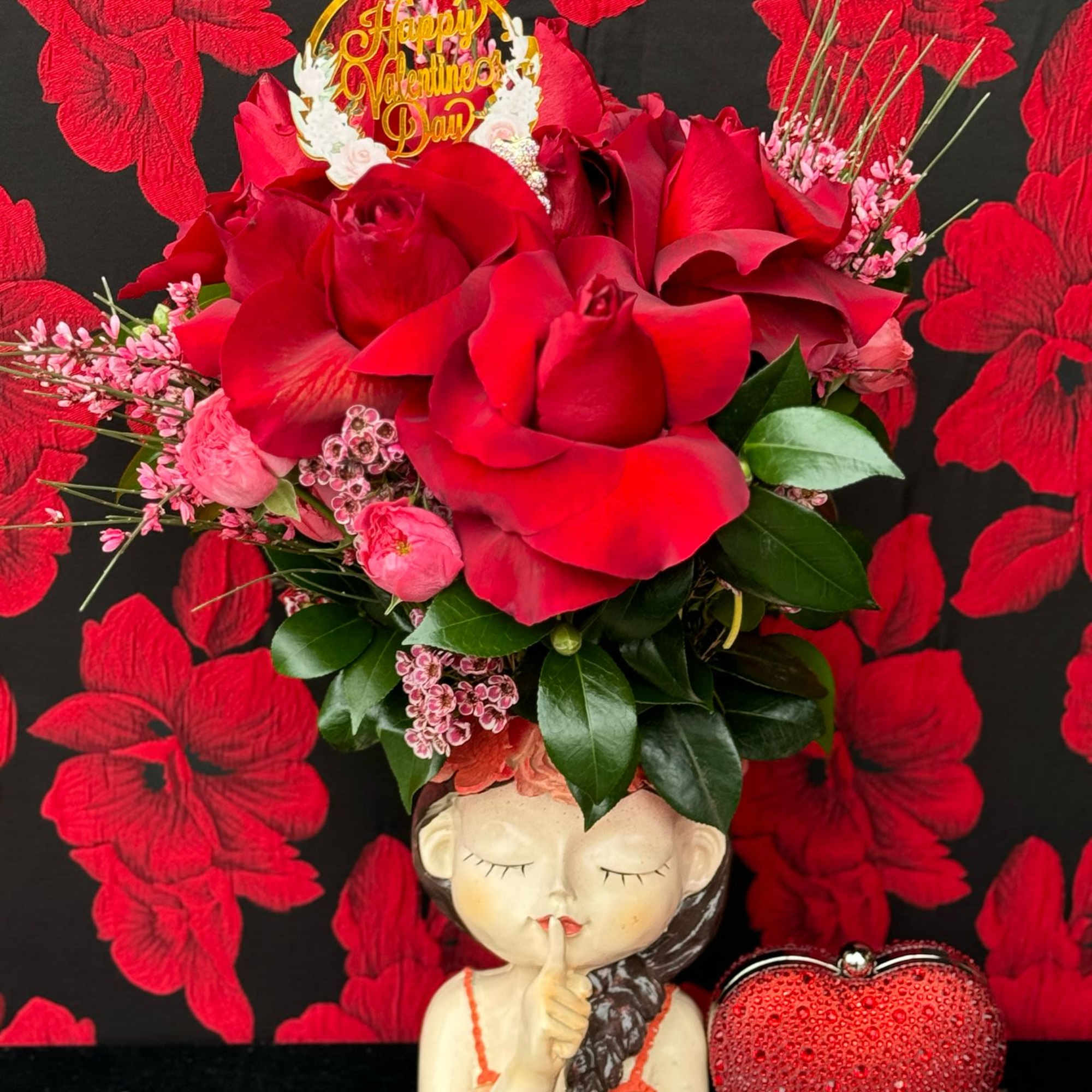 A stunning combination of passionate red roses arranged elegantly in a beautiful, photo 2 of 2