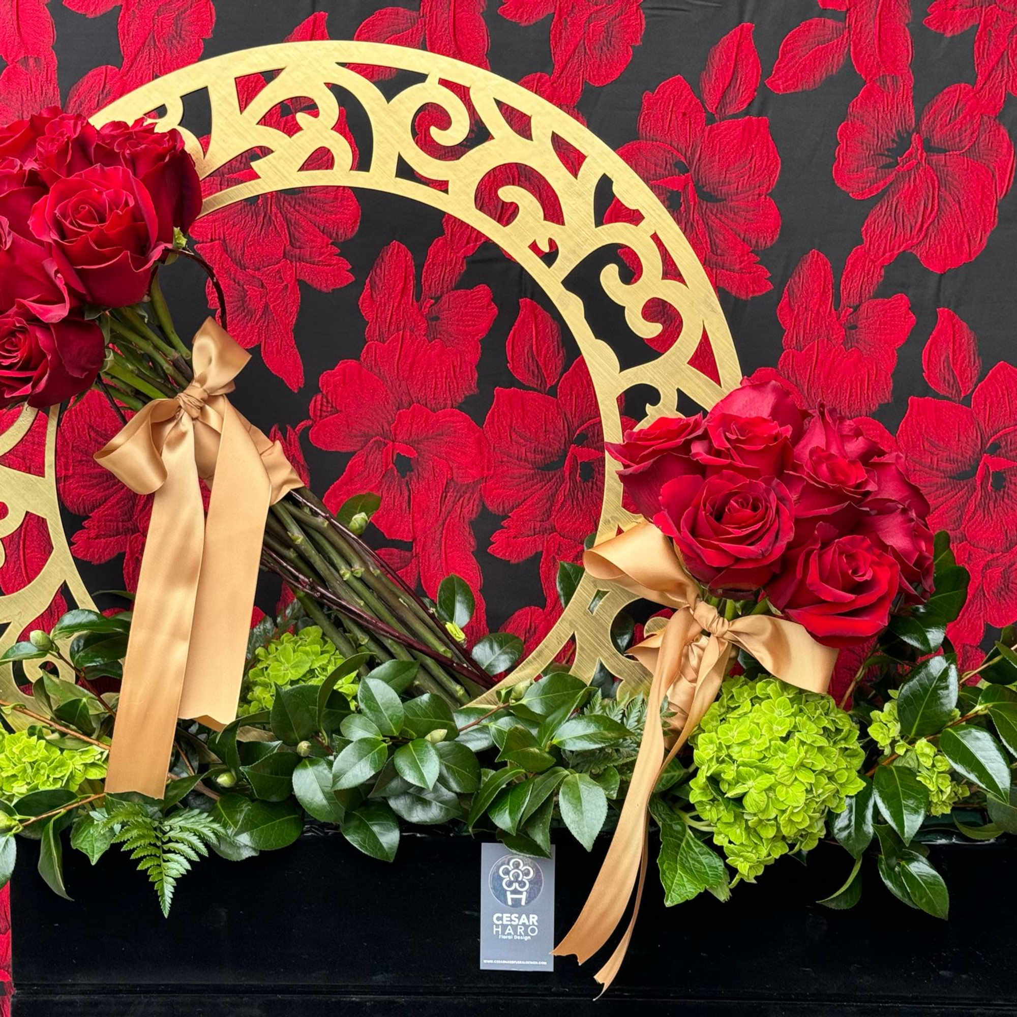 A luxurious and sophisticated arrangement of deep red roses nestled in a, photo 2 of 2