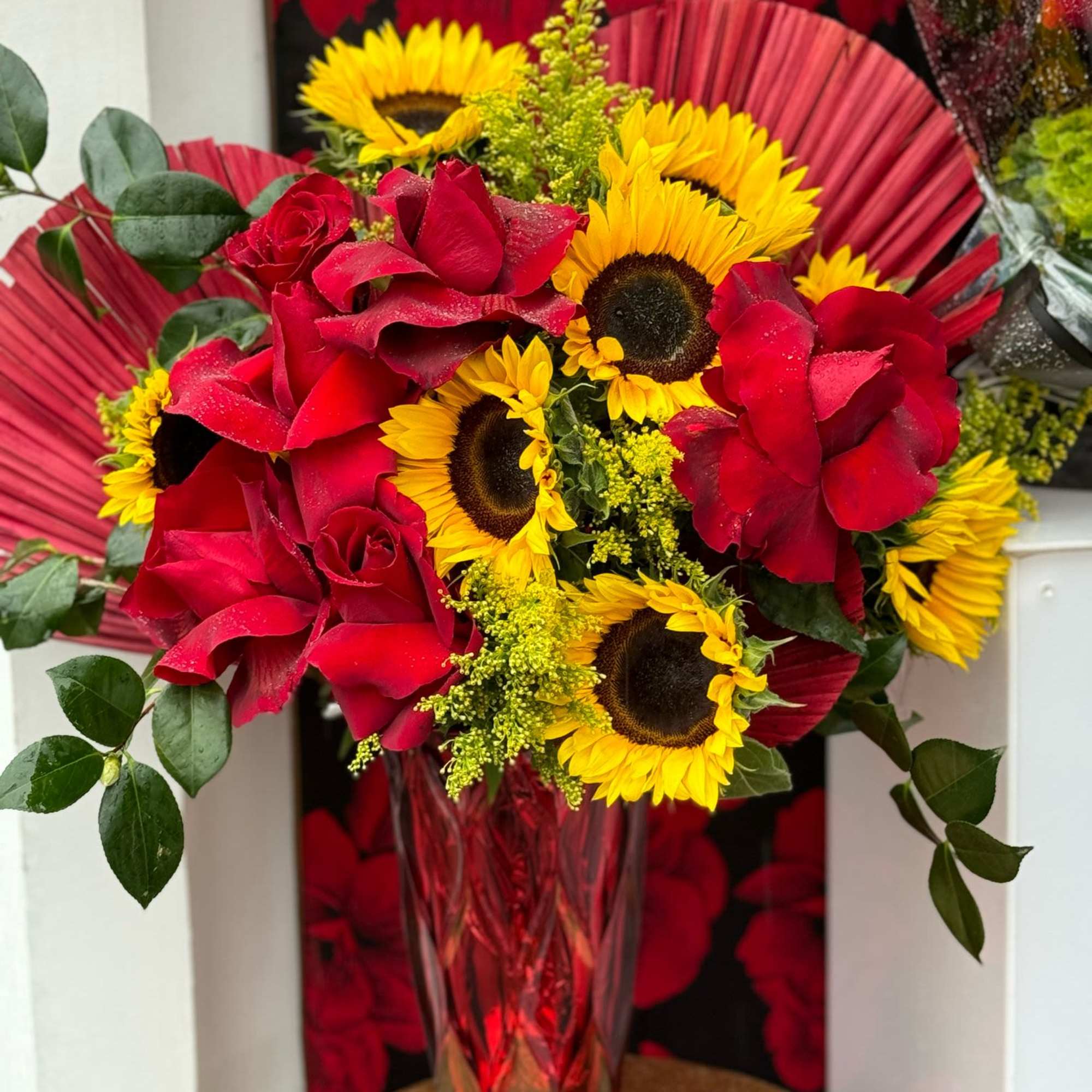 A radiant arrangement featuring bright yellow sunflowers paired with rich red roses, photo 2 of 2