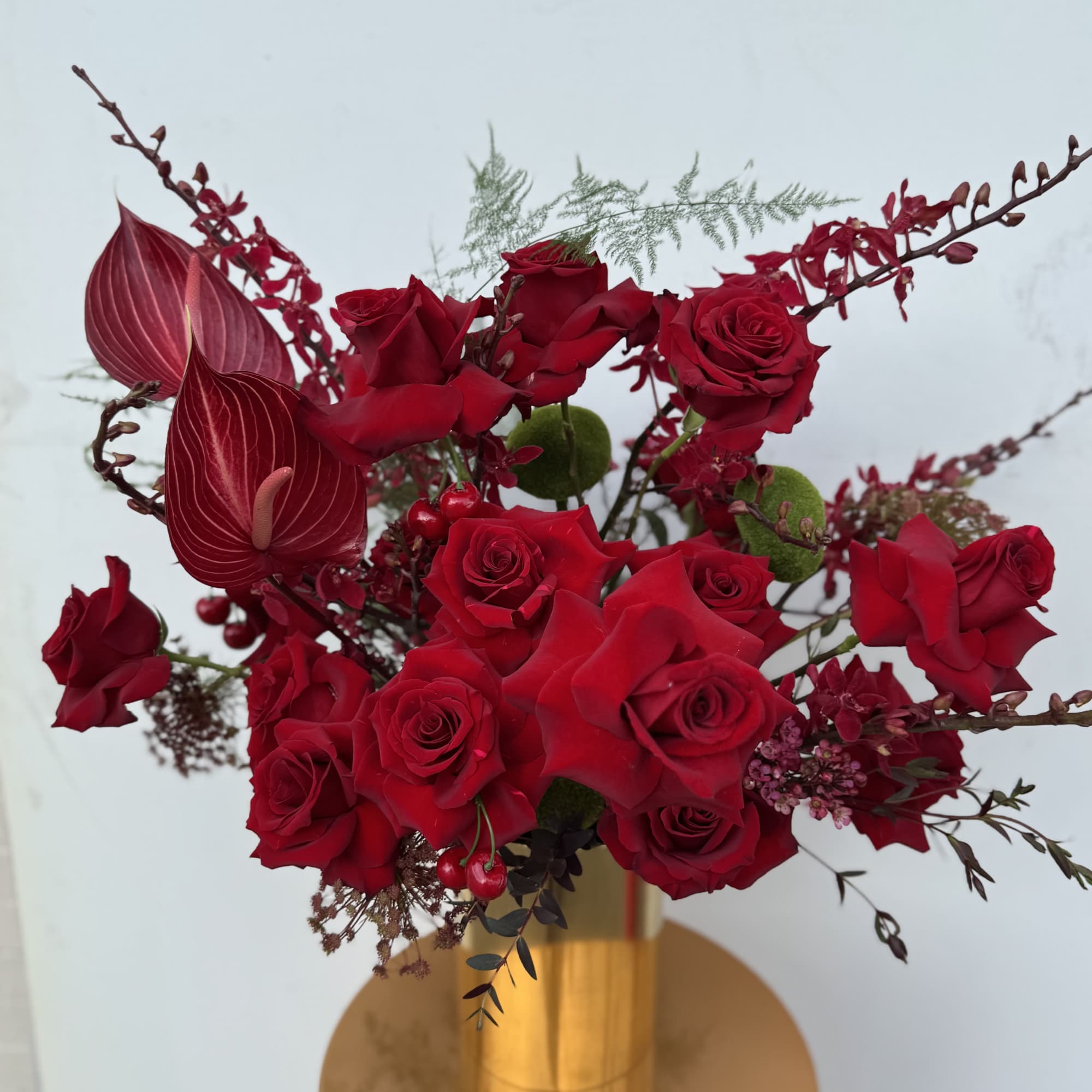 Modern arrangement with wild reds untamed, sensual, with a new look to