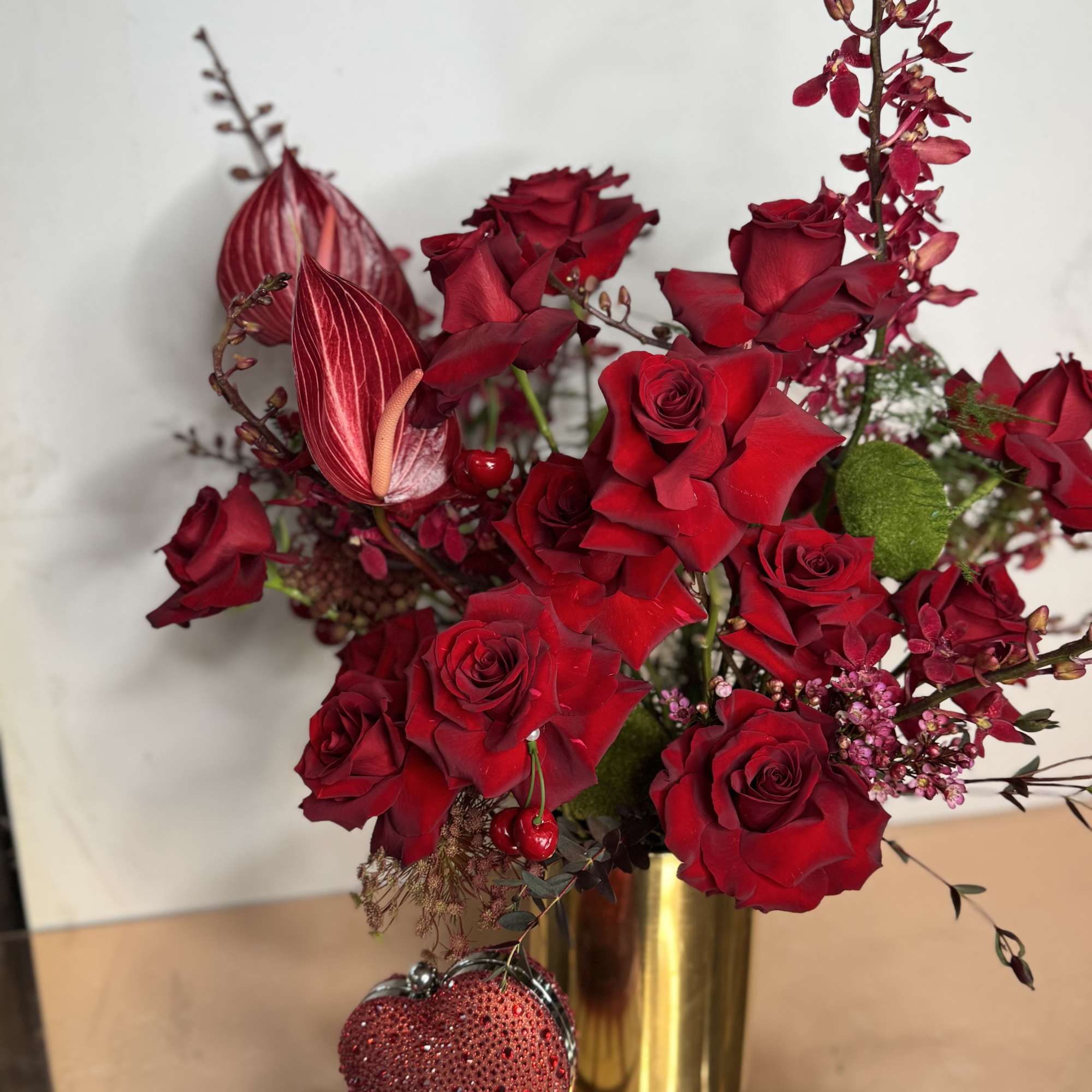 Modern arrangement with wild reds untamed, sensual, with a new look to, photo 2 of 2