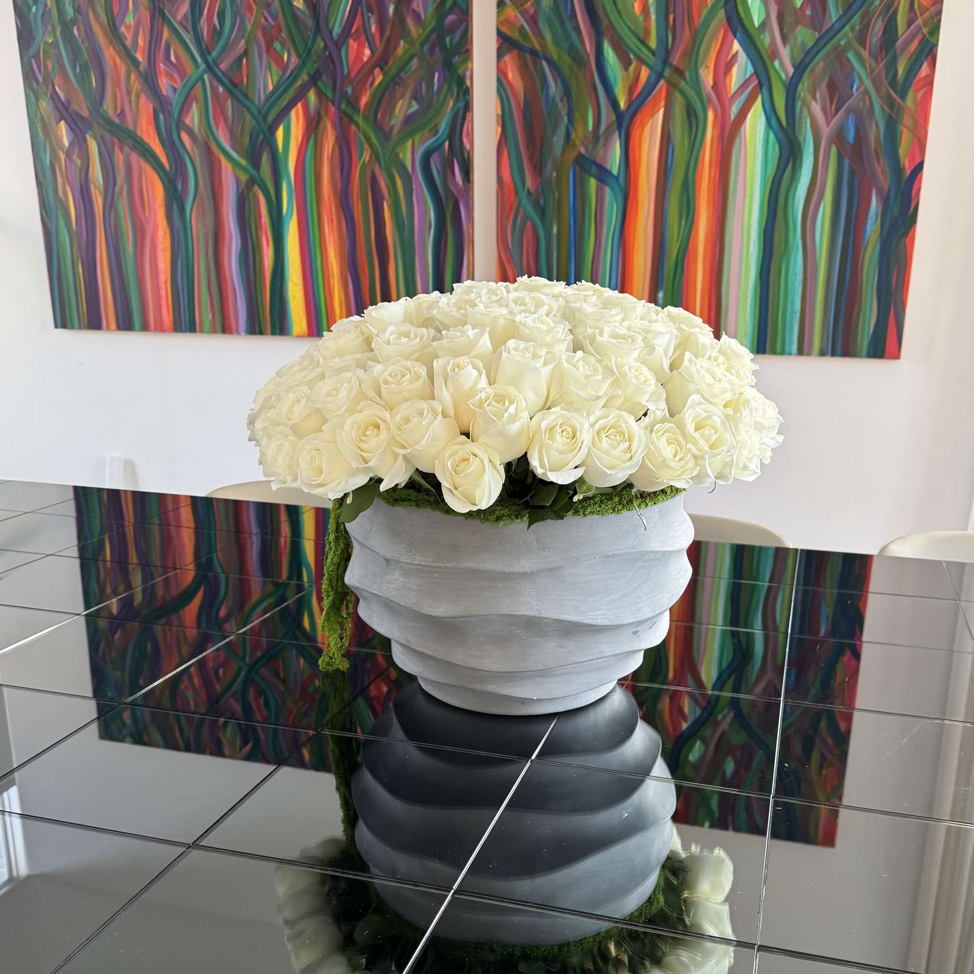 Pure white roses in a concrete vase, filling the space with structure, photo 2 of 2