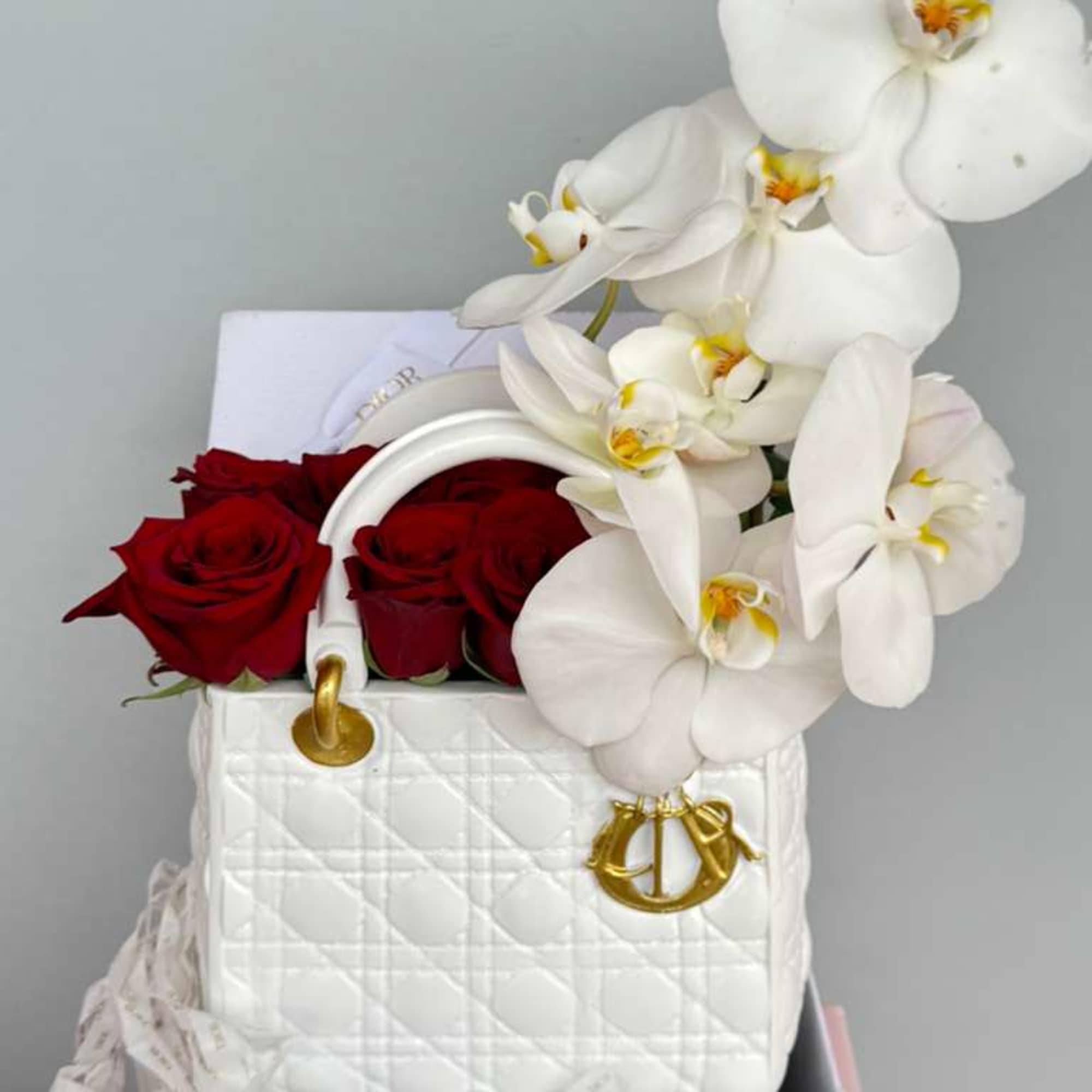 Elegant red roses and Sophisticated Orchids artfully arranged in a stunning white, photo 2 of 2
