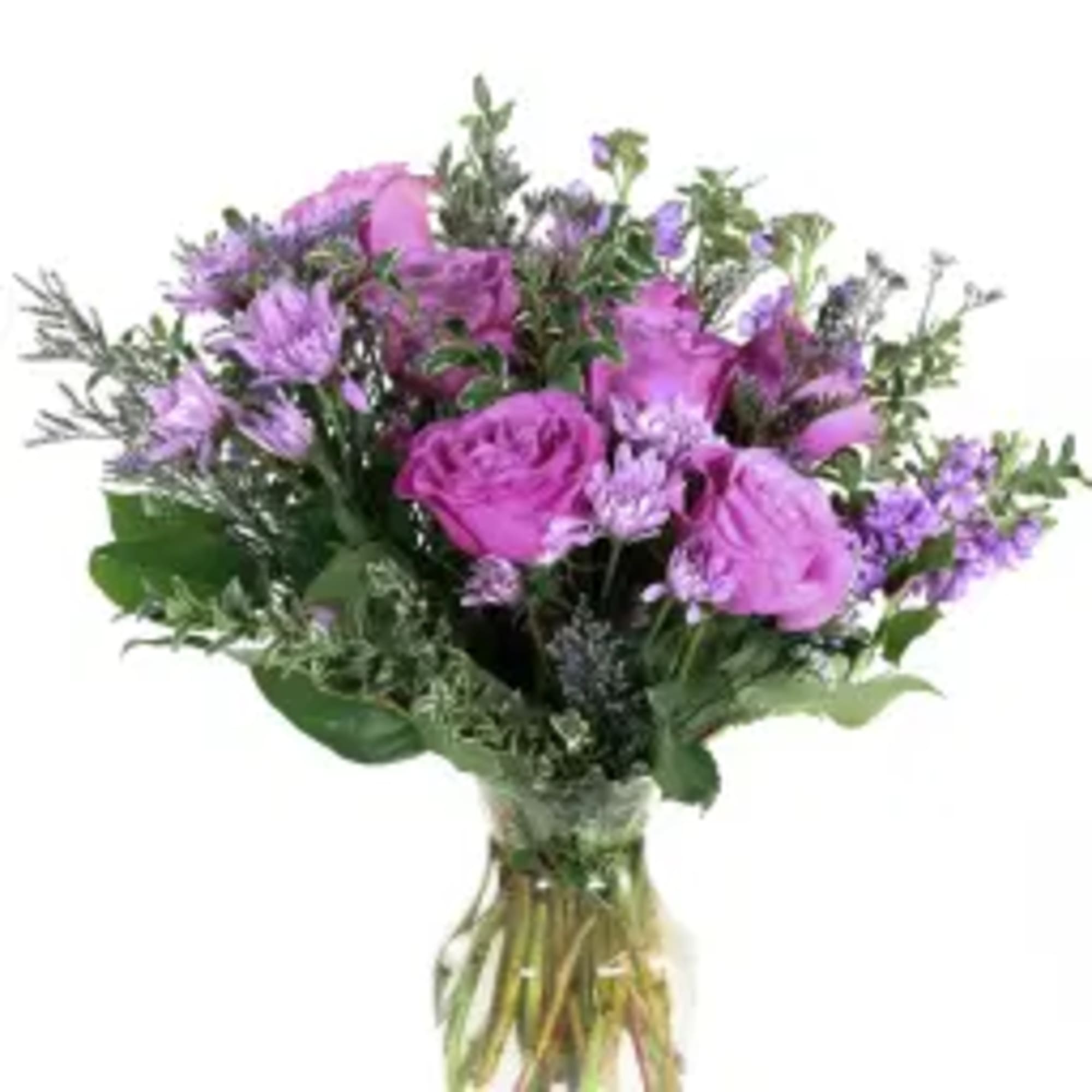 Purple bouquet of roses and mixed blooms in a clear glass vase