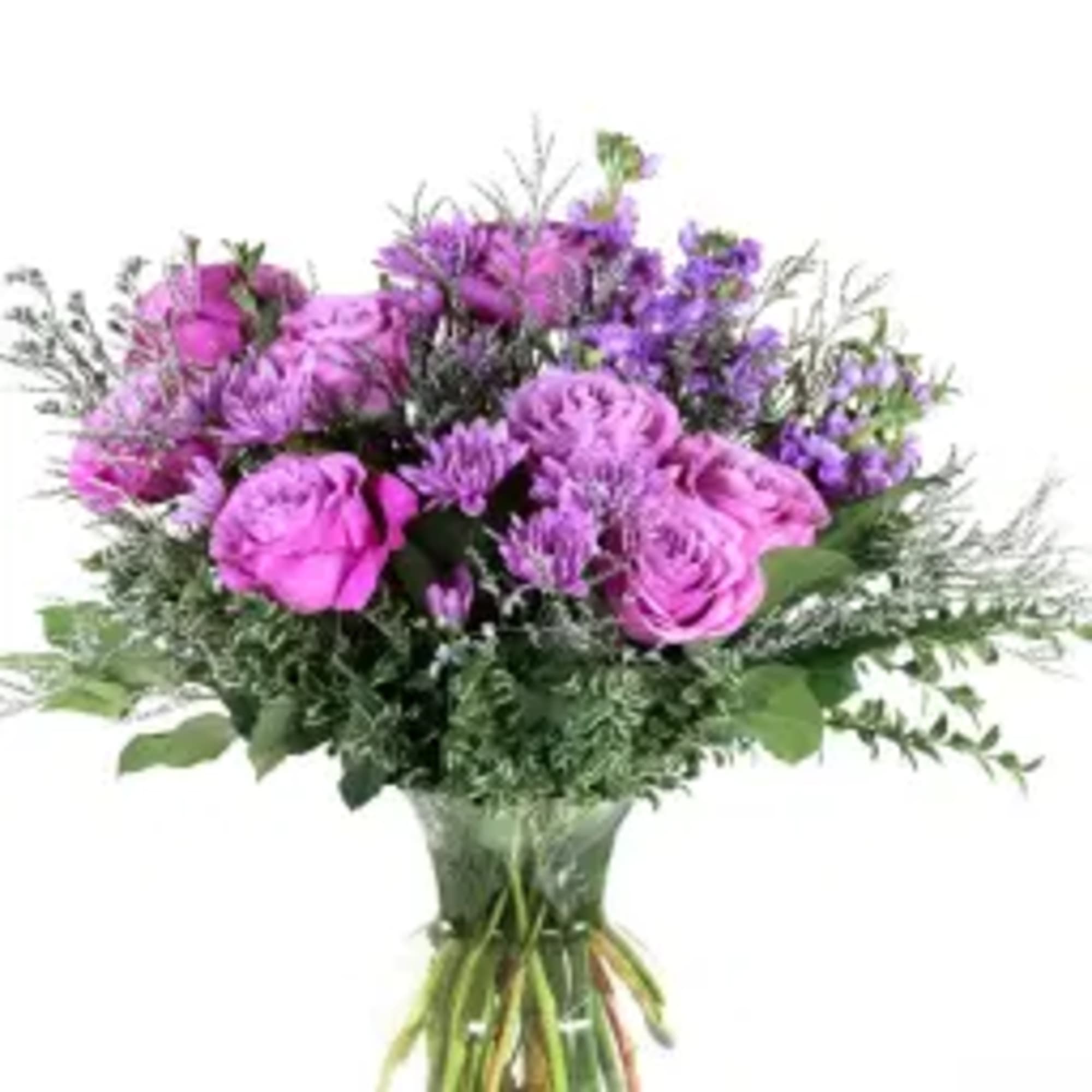 Bouquet of pink and purple flowers in a clear glass vase