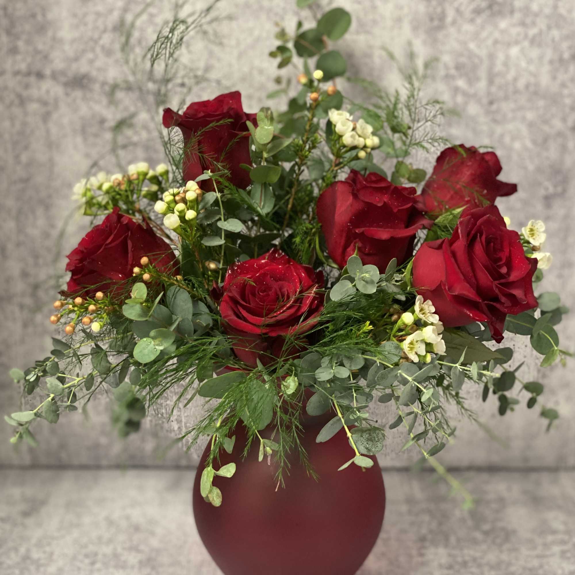 A half dozen roses with a variety of greenery and eucalyptus come, photo 2 of 2