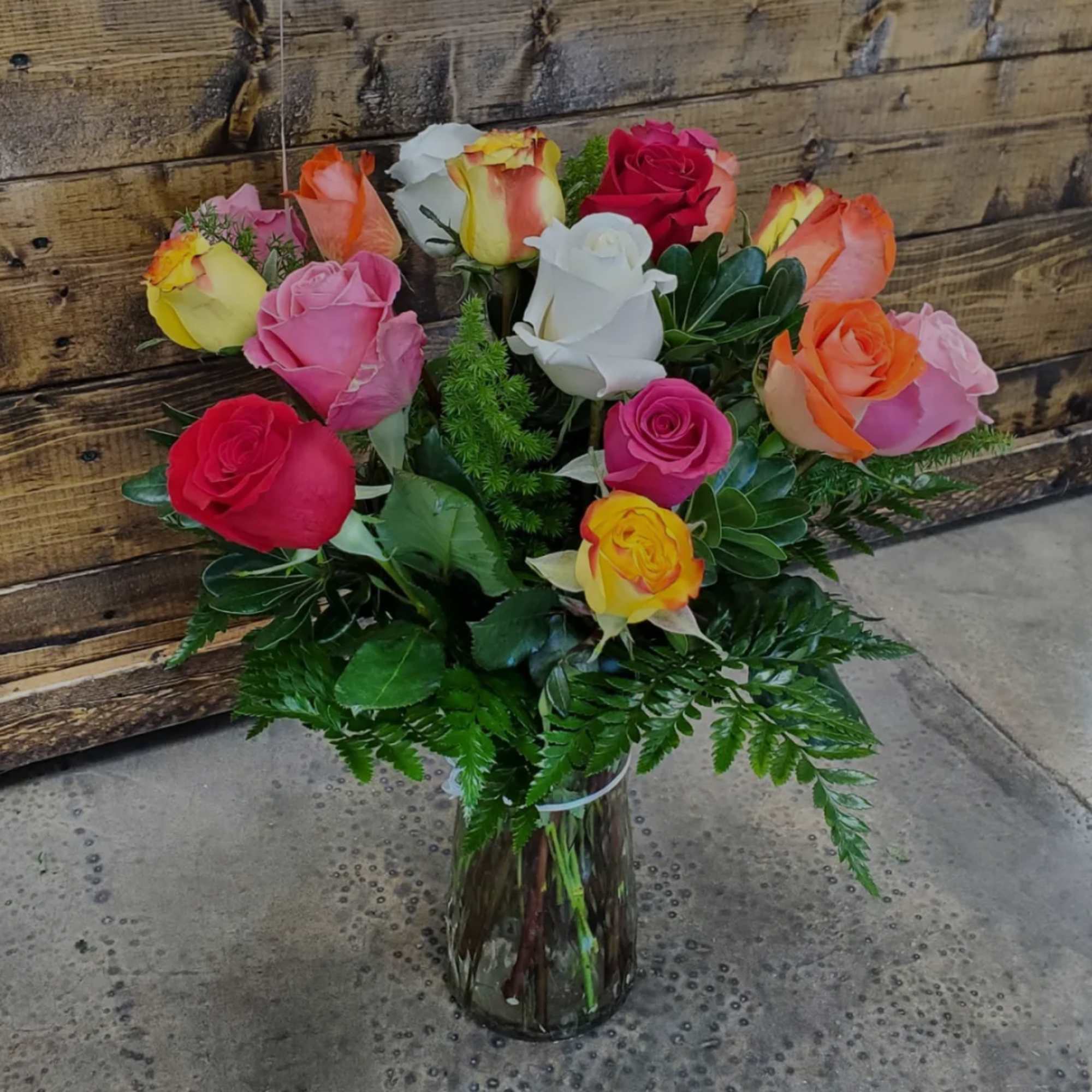 Bouquet of multicolored roses in a glass vase, photo 2 of 2