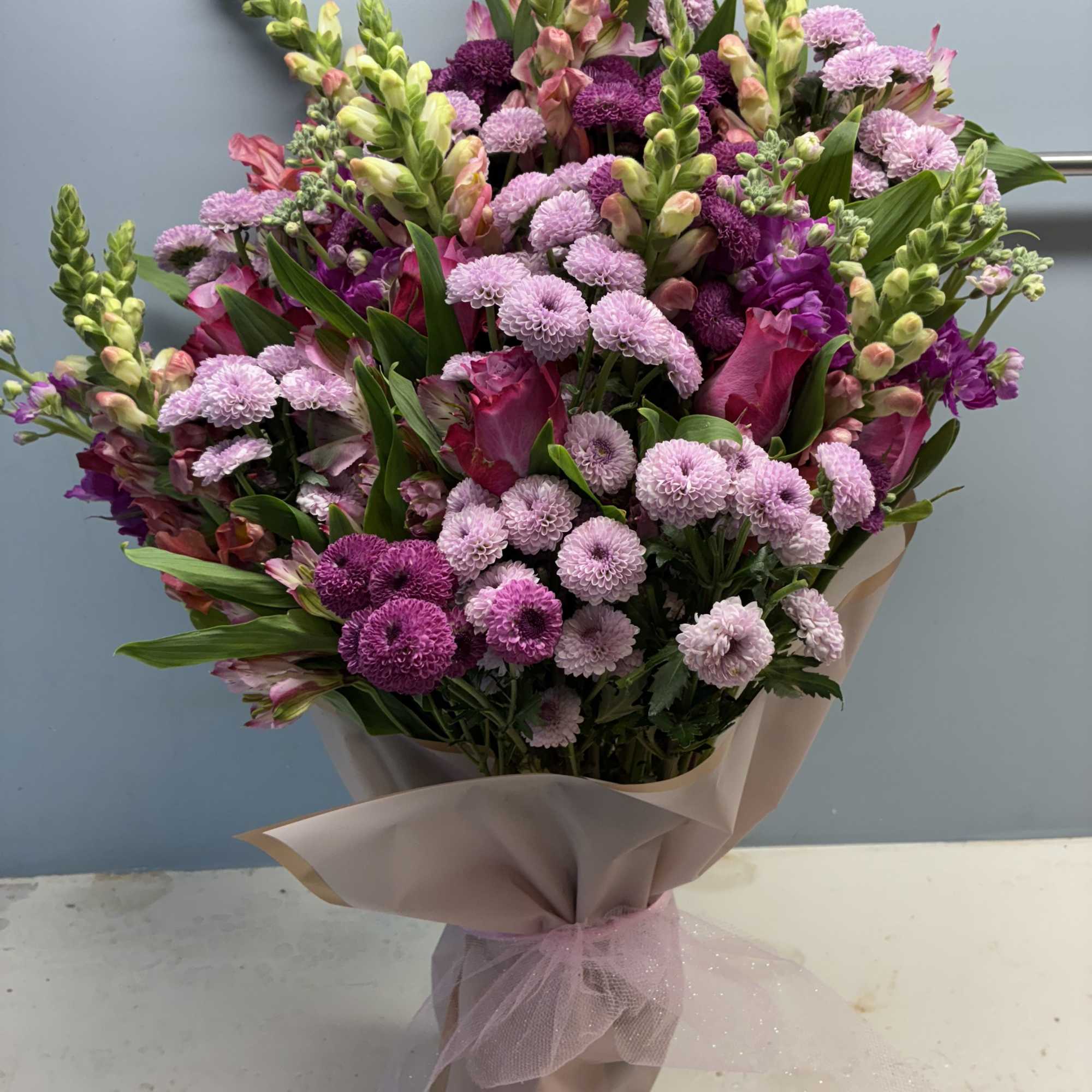 a stunning mix of our freshest blooms hand picked and designed by, photo 2 of 2