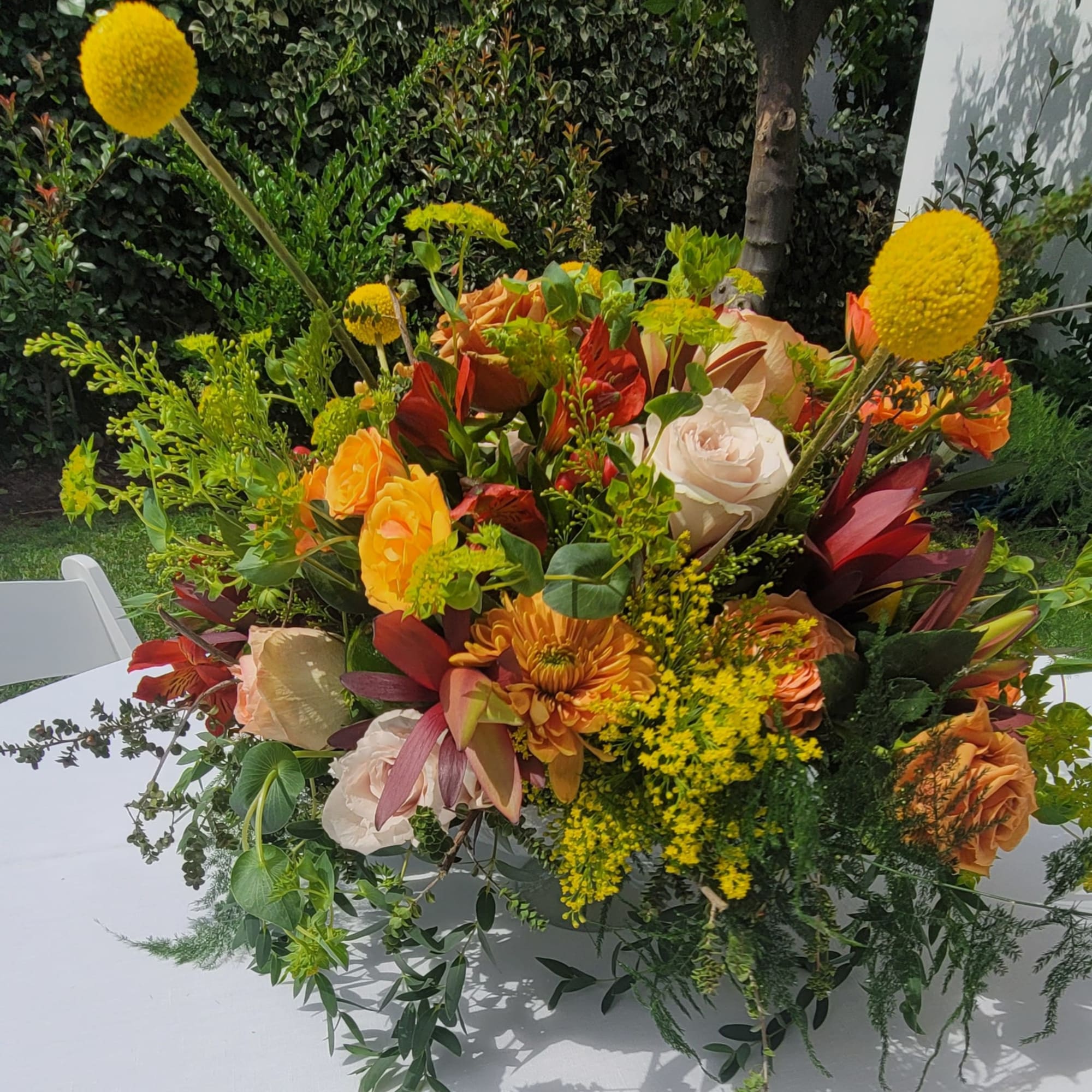 Large mixed bouquet with orange, white, and yellow flowers