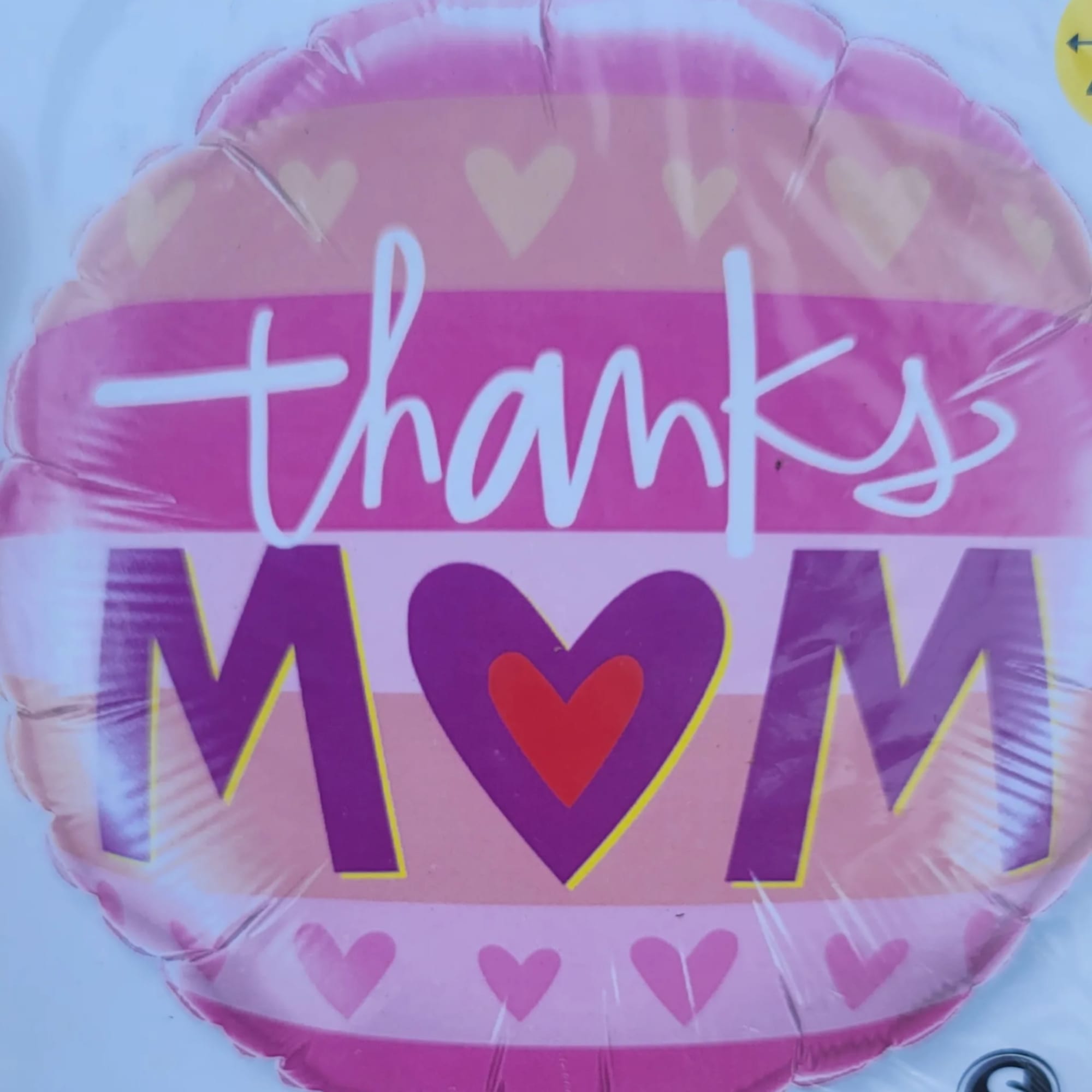 Pink heart-shaped balloon with "thanks MOM" text