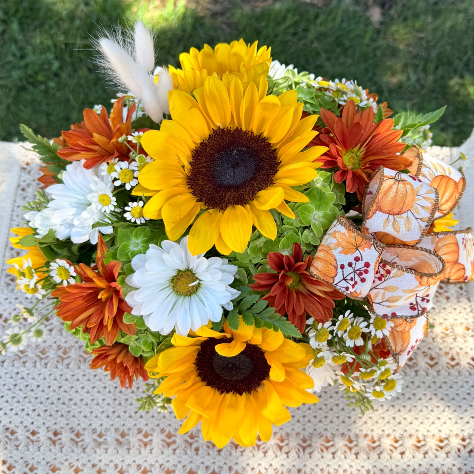 Sunflower bouquet with white daisies and orange mums, tied with pumpkin ribbon
