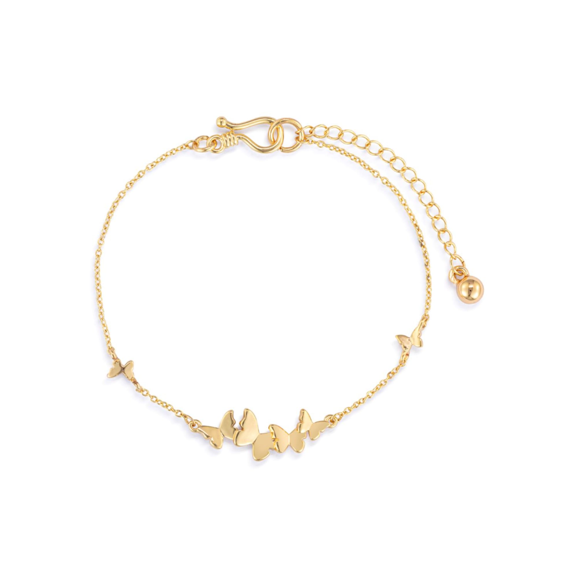 Gold butterfly charm bracelet on a white background