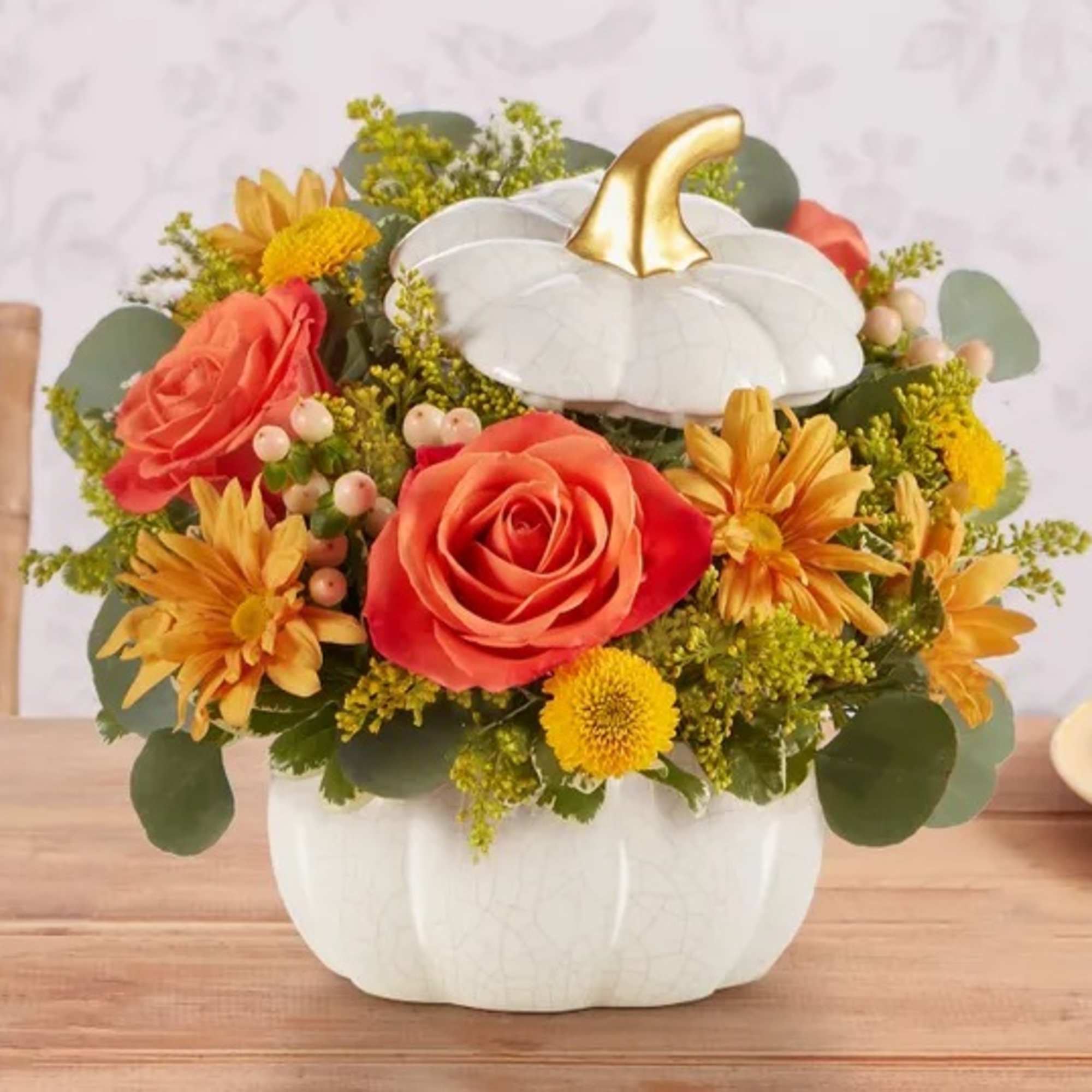 A plentiful mix of blooms gives our autumn arrangement an undeniable charm.
