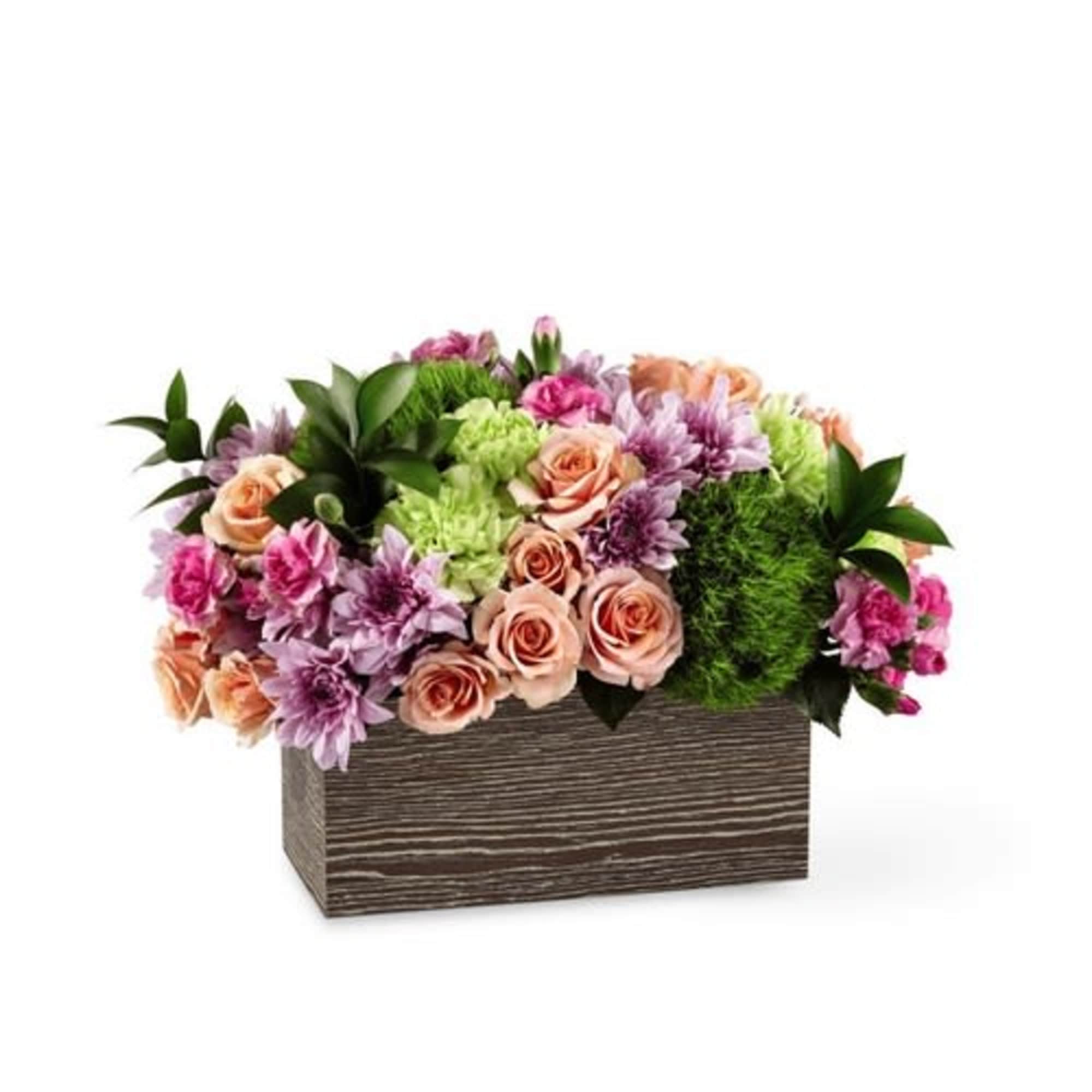 Mixed pink and purple flowers in a rectangular wooden box