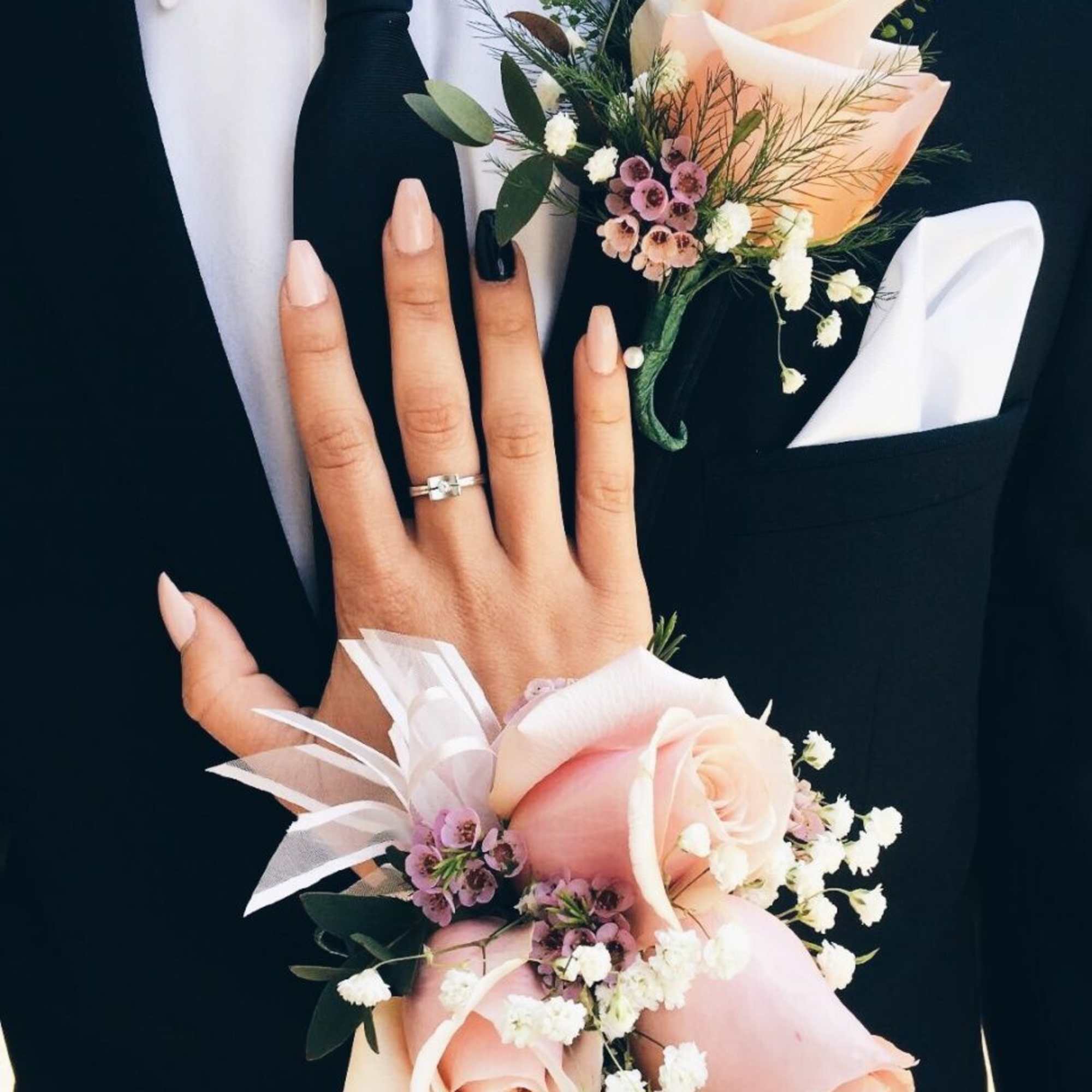 A classic pink corsage hand-tied in pink satin that compliments any outfit.