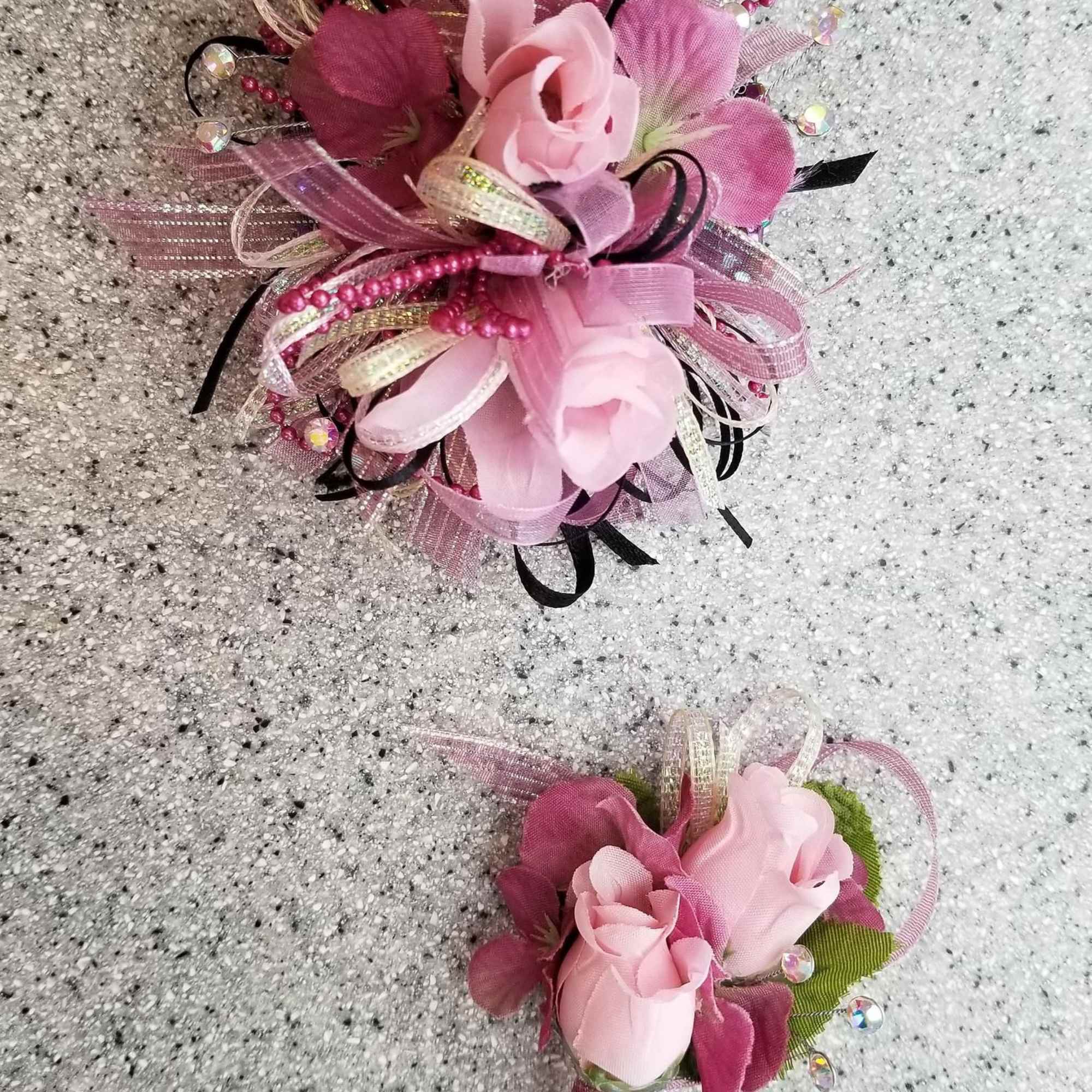 A classic pink corsage hand-tied in pink satin that compliments any outfit.