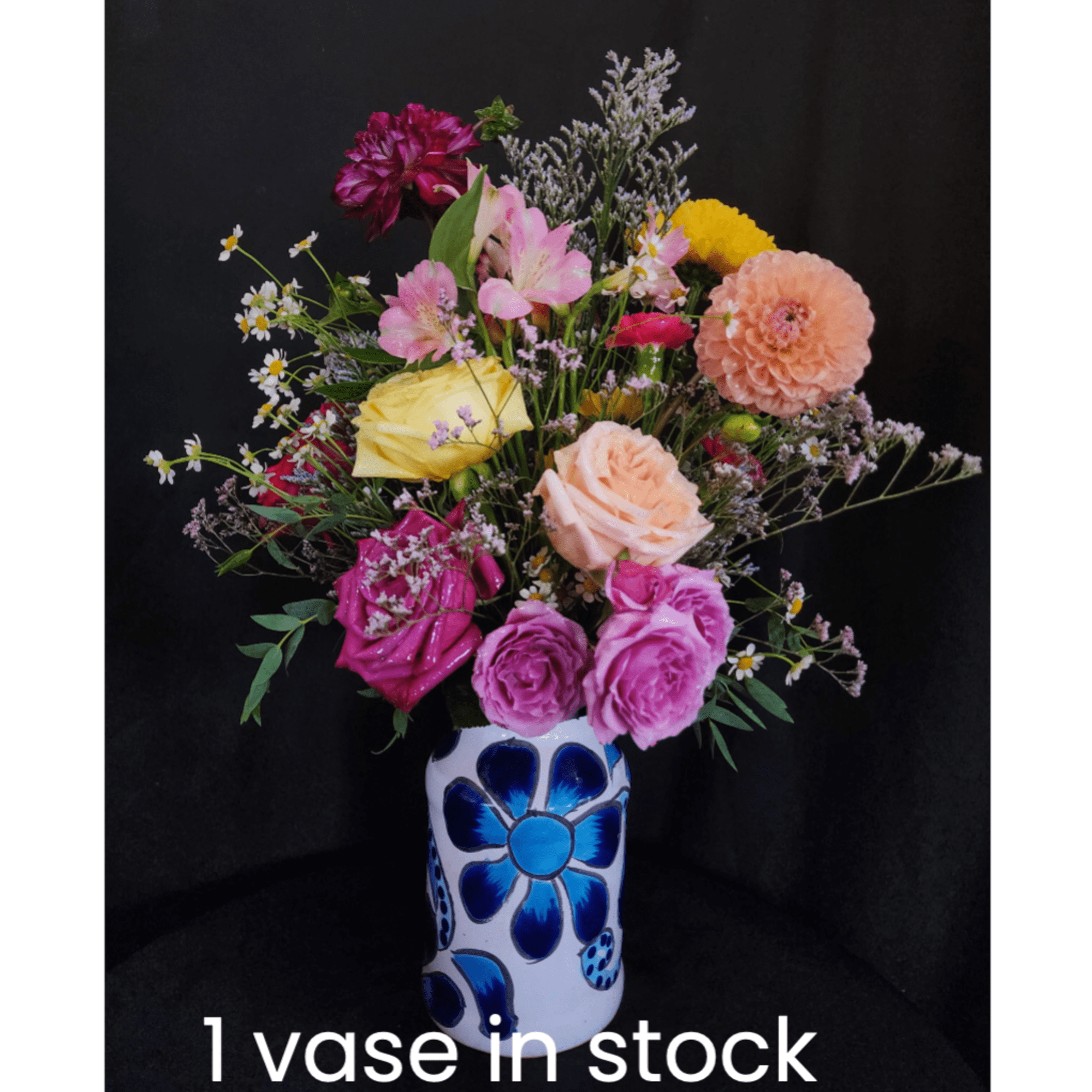 Mixed bouquet in a blue-and-white painted vase
