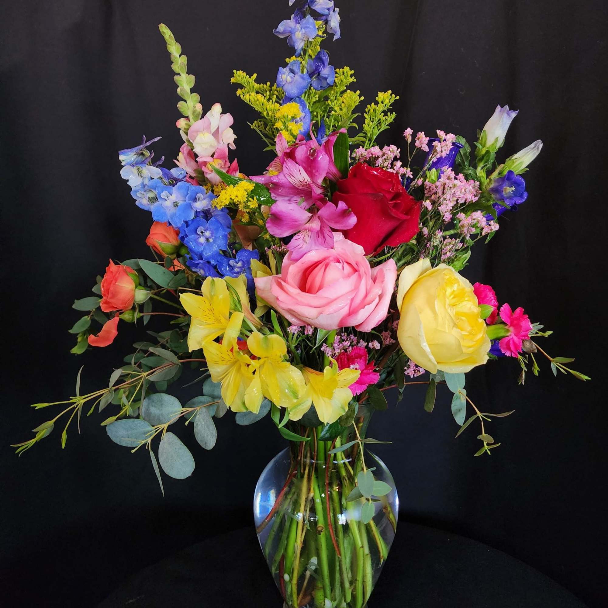 Colorful mixed bouquet in a clear glass vase