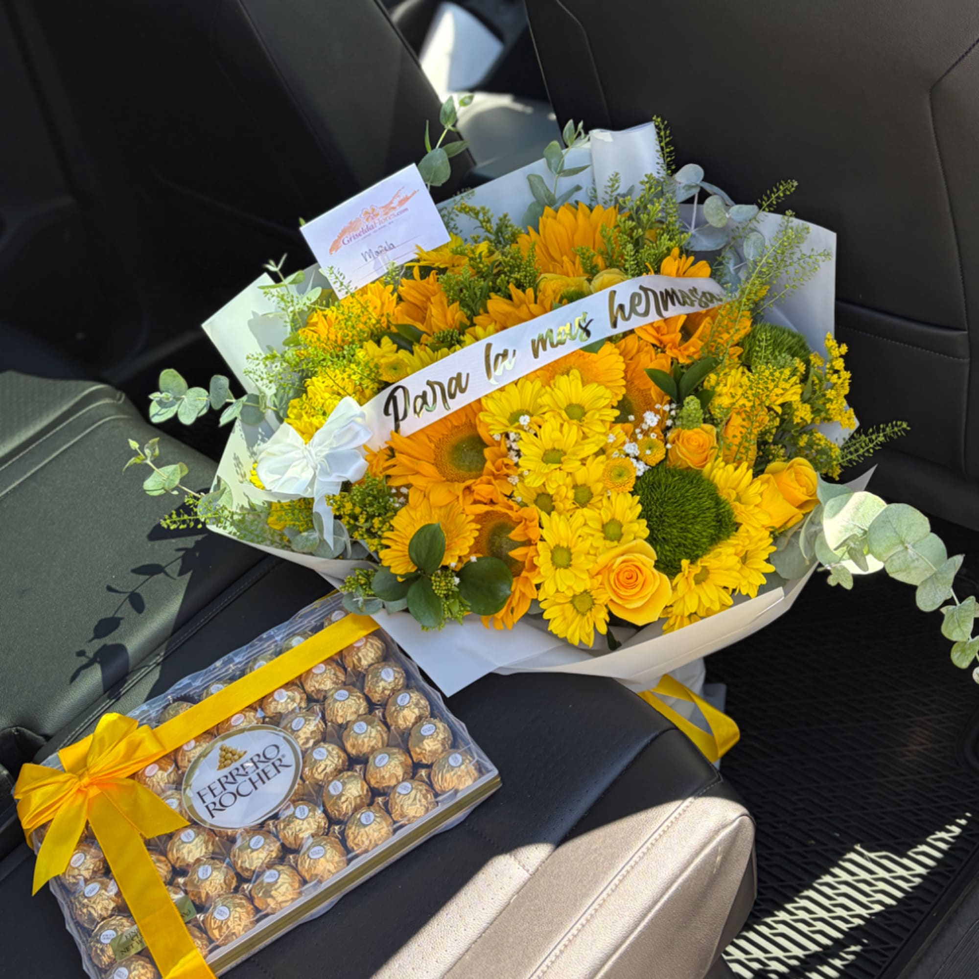 Yellow flower bouquet with a box of Ferrero Rocher chocolates
