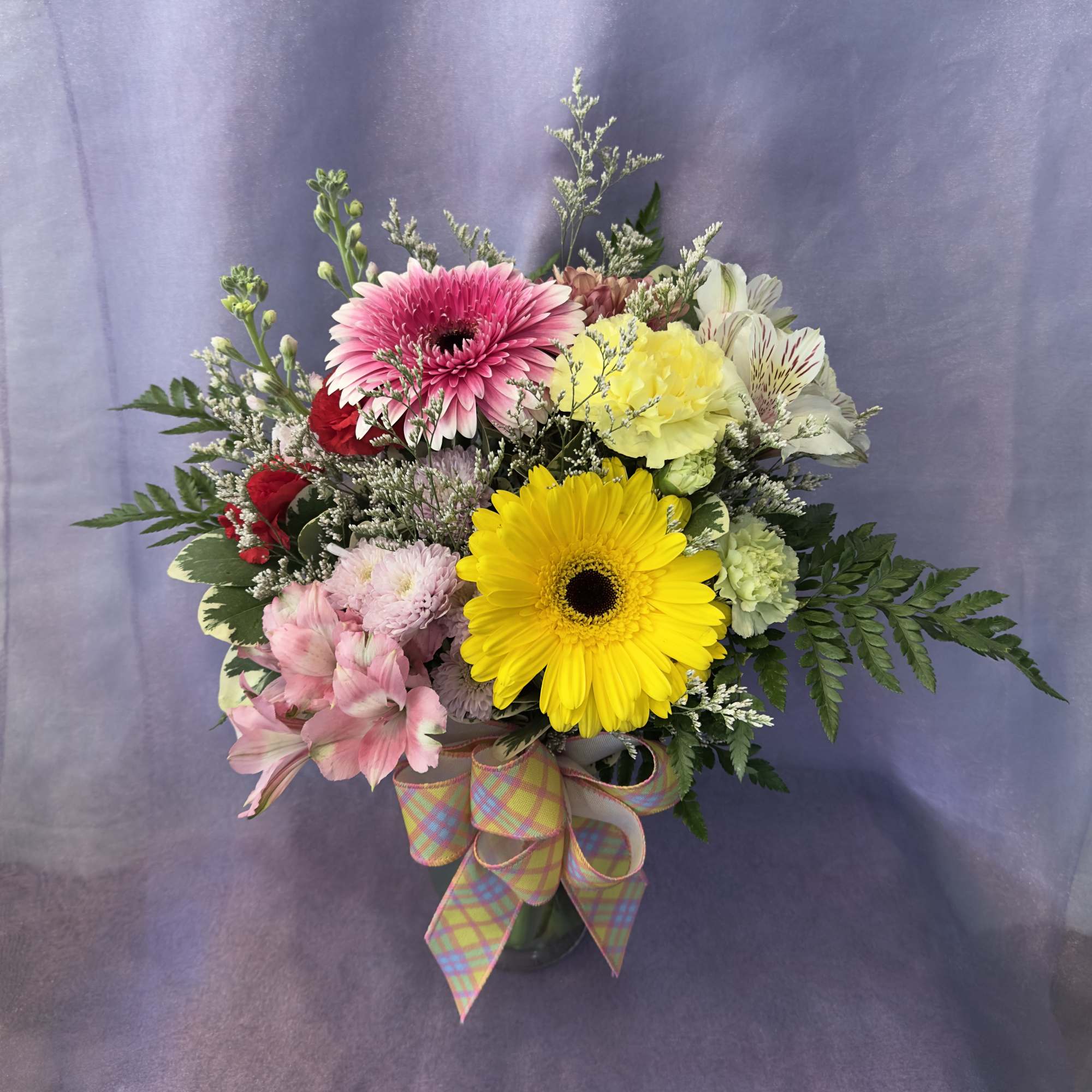 Send this brightly colored arrangement for any occasion!

Please keep in mind each