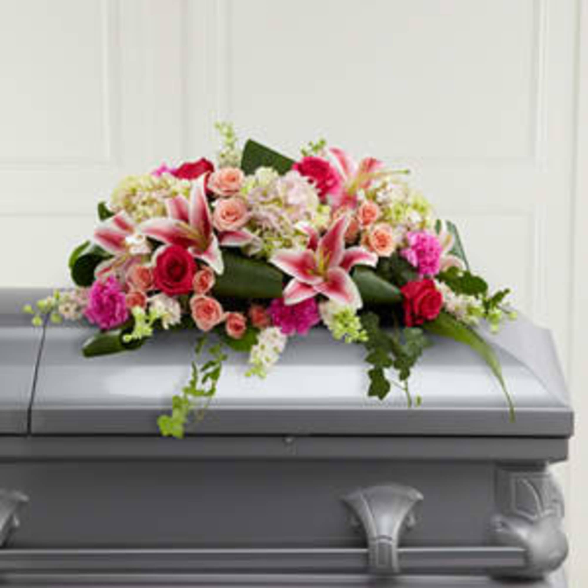 Pink and white floral casket spray with lilies and roses, photo 2 of 3