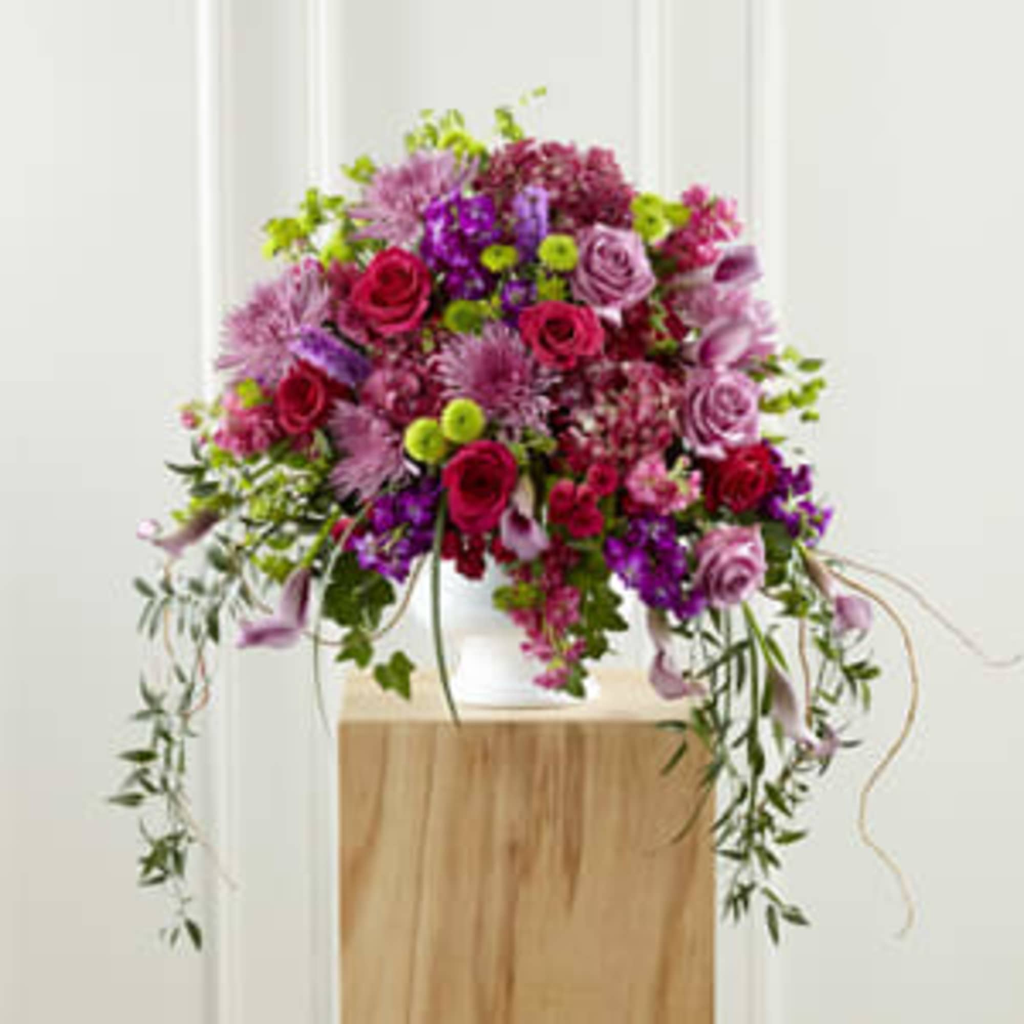 Large pink and purple floral arrangement in a white vase, photo 2 of 3