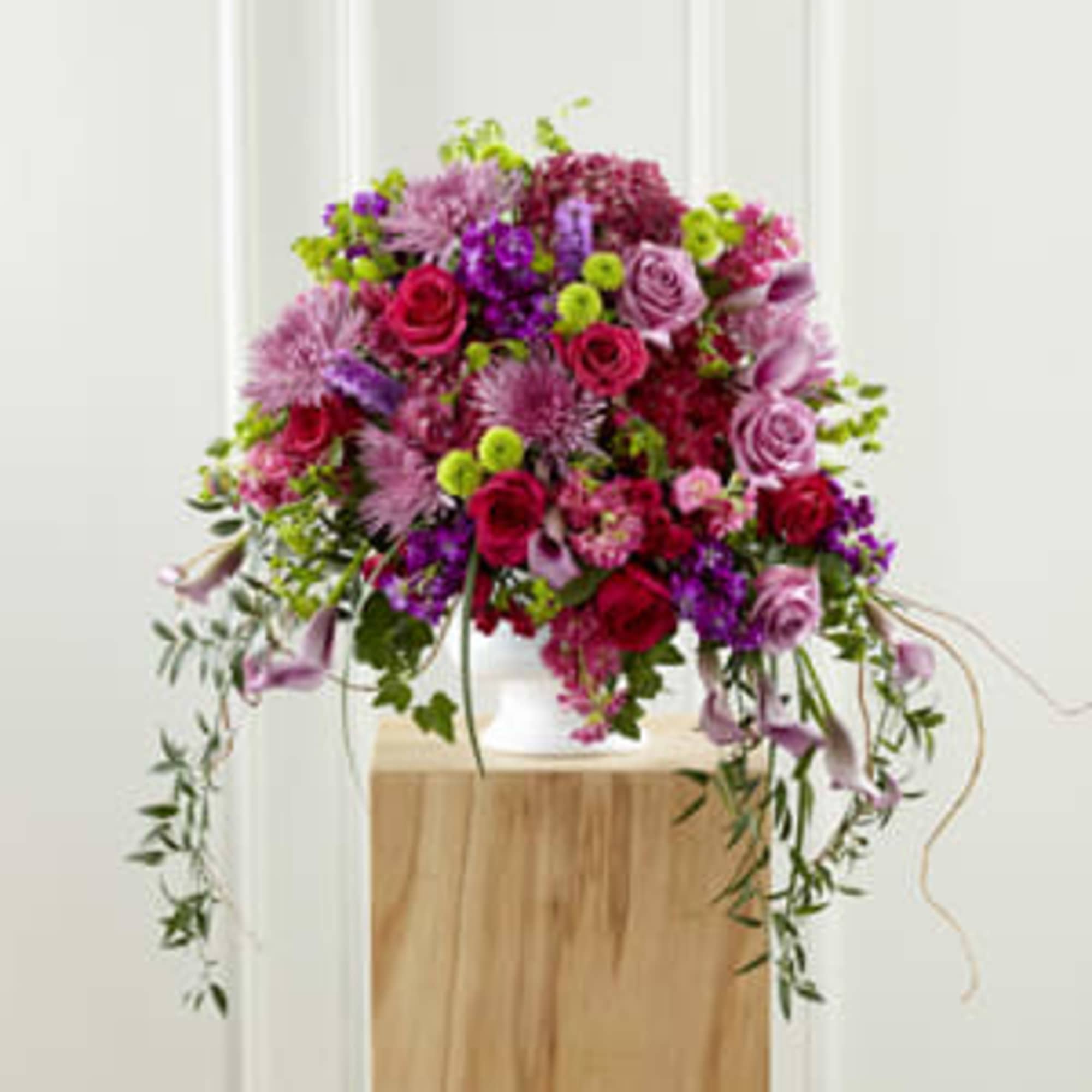 Large pink and purple floral arrangement in a white vase, photo 3 of 3