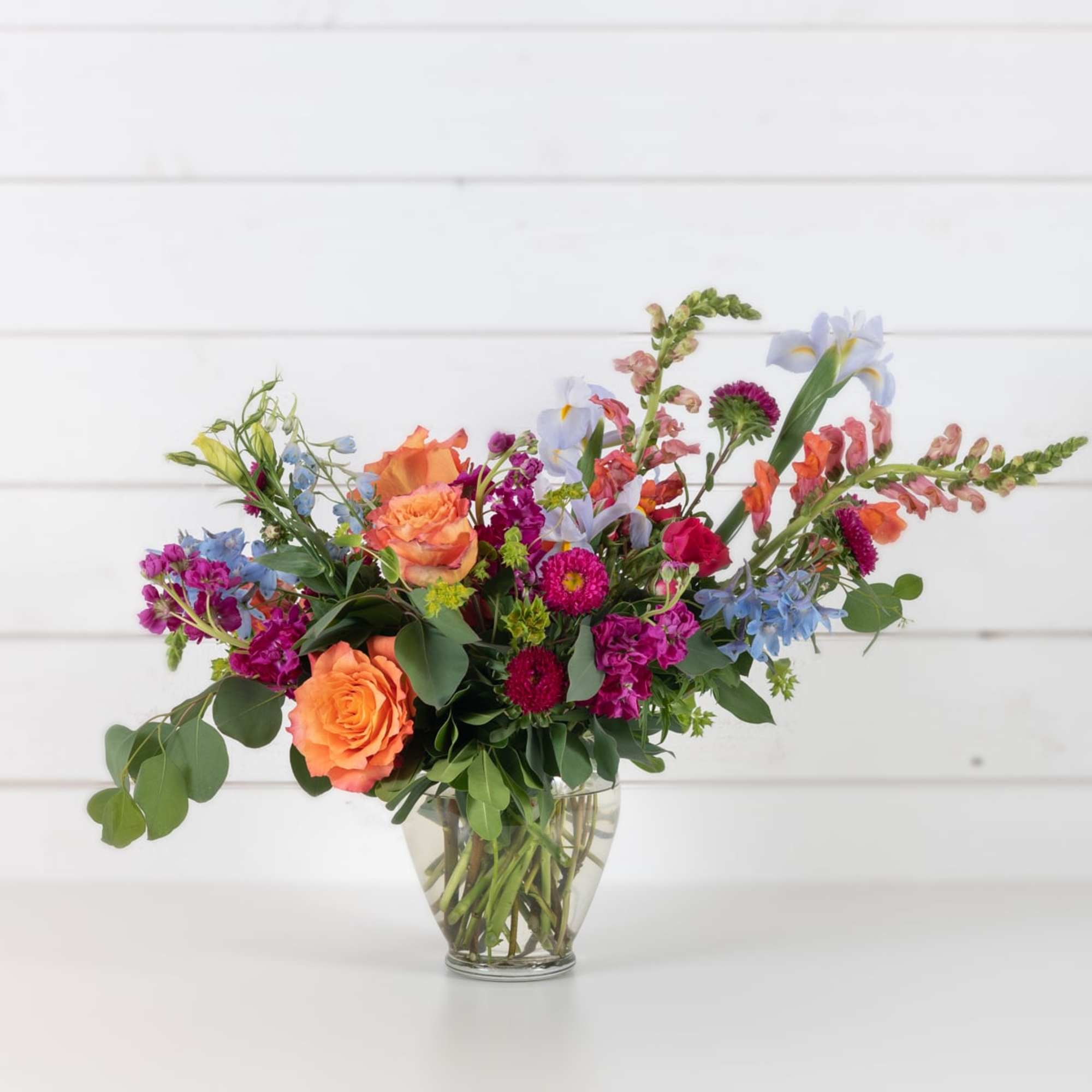 Colorful mixed bouquet in a clear glass vase